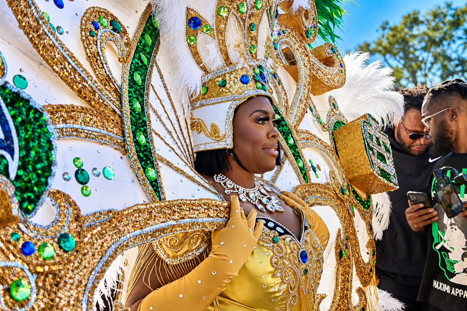 Woman in ornate gold and green carnival costume with jeweled headdress at a festive parade.
