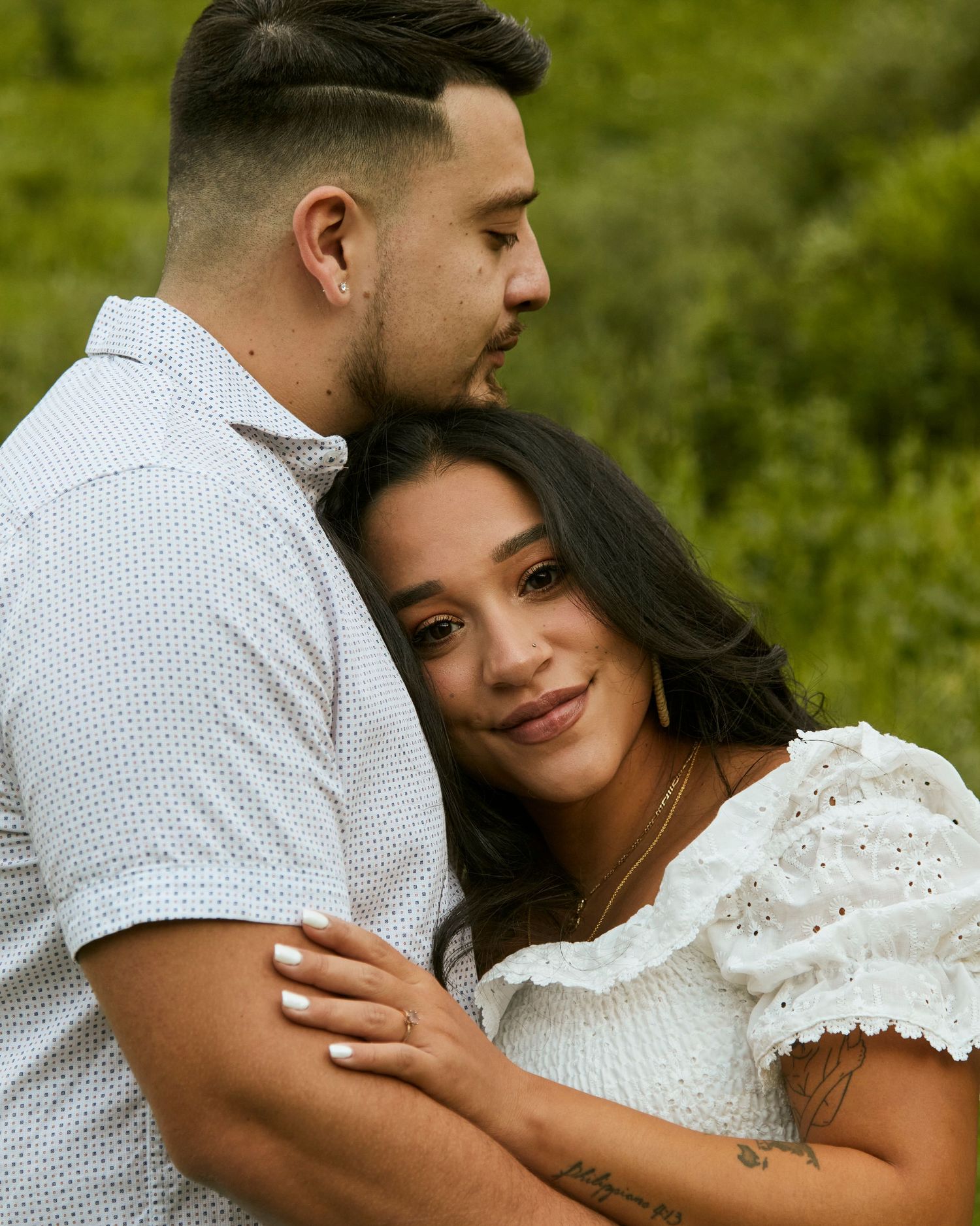 An intimate couples portrait in a mountain meadow showing love and connection.