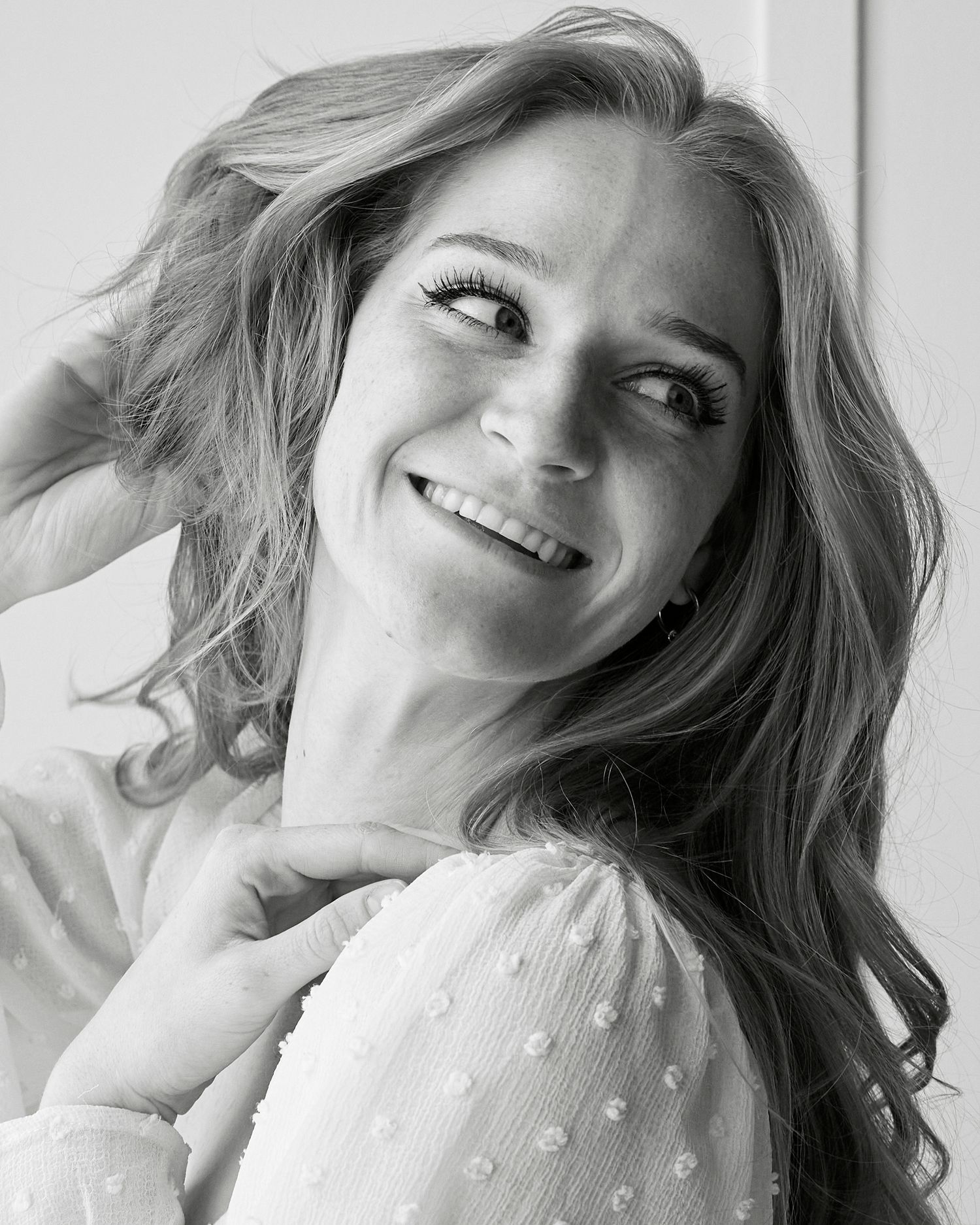 Black and white portrait showing natural joy and movement.
