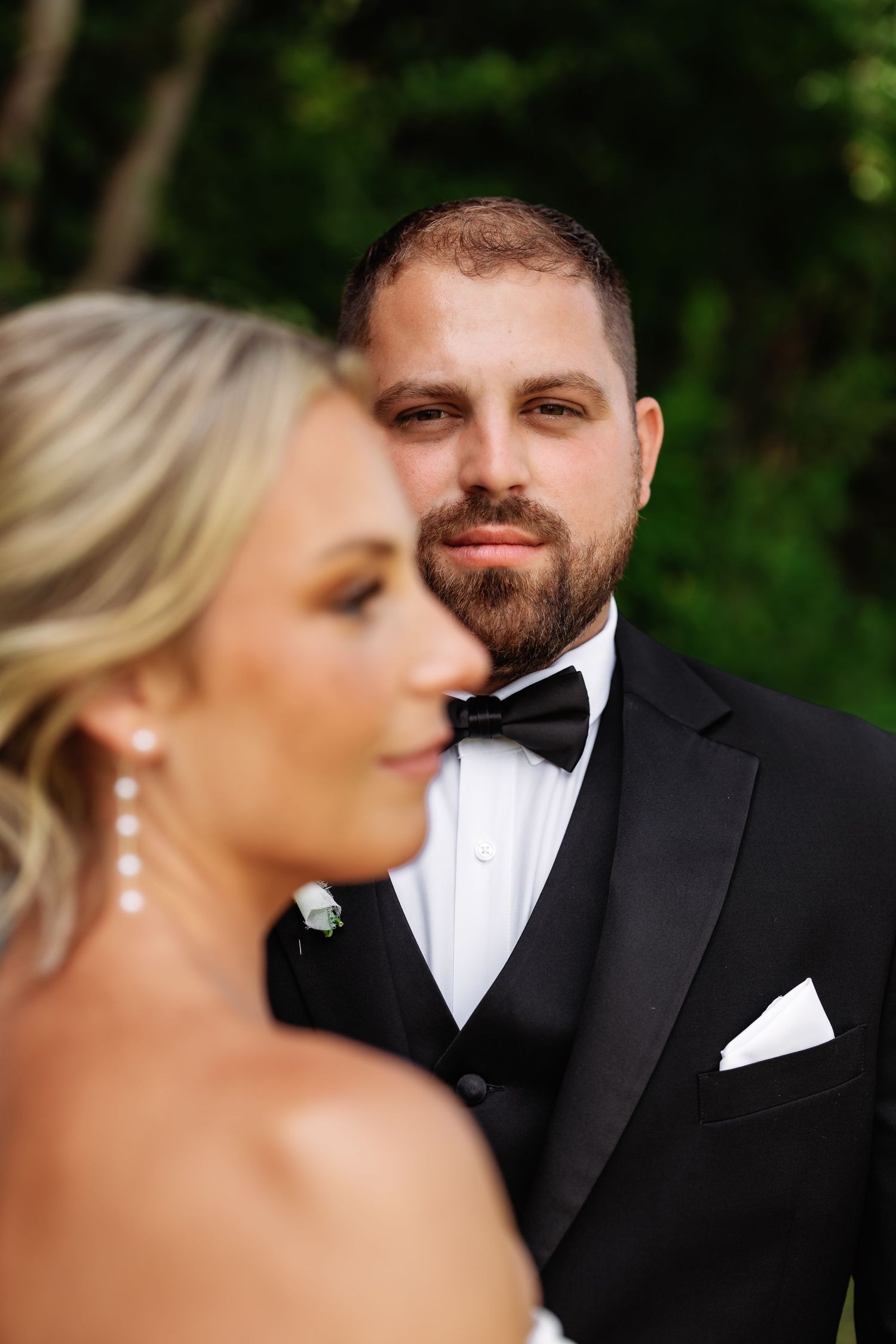 A bride and groom share intimate moments in a series of romantic outdoor wedding portraits.