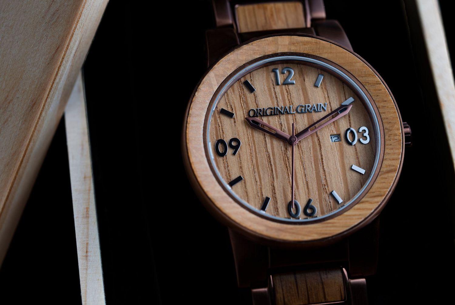 Original Grain wooden watch with zebra wood dial and bracelet band displayed in a dark gift box.