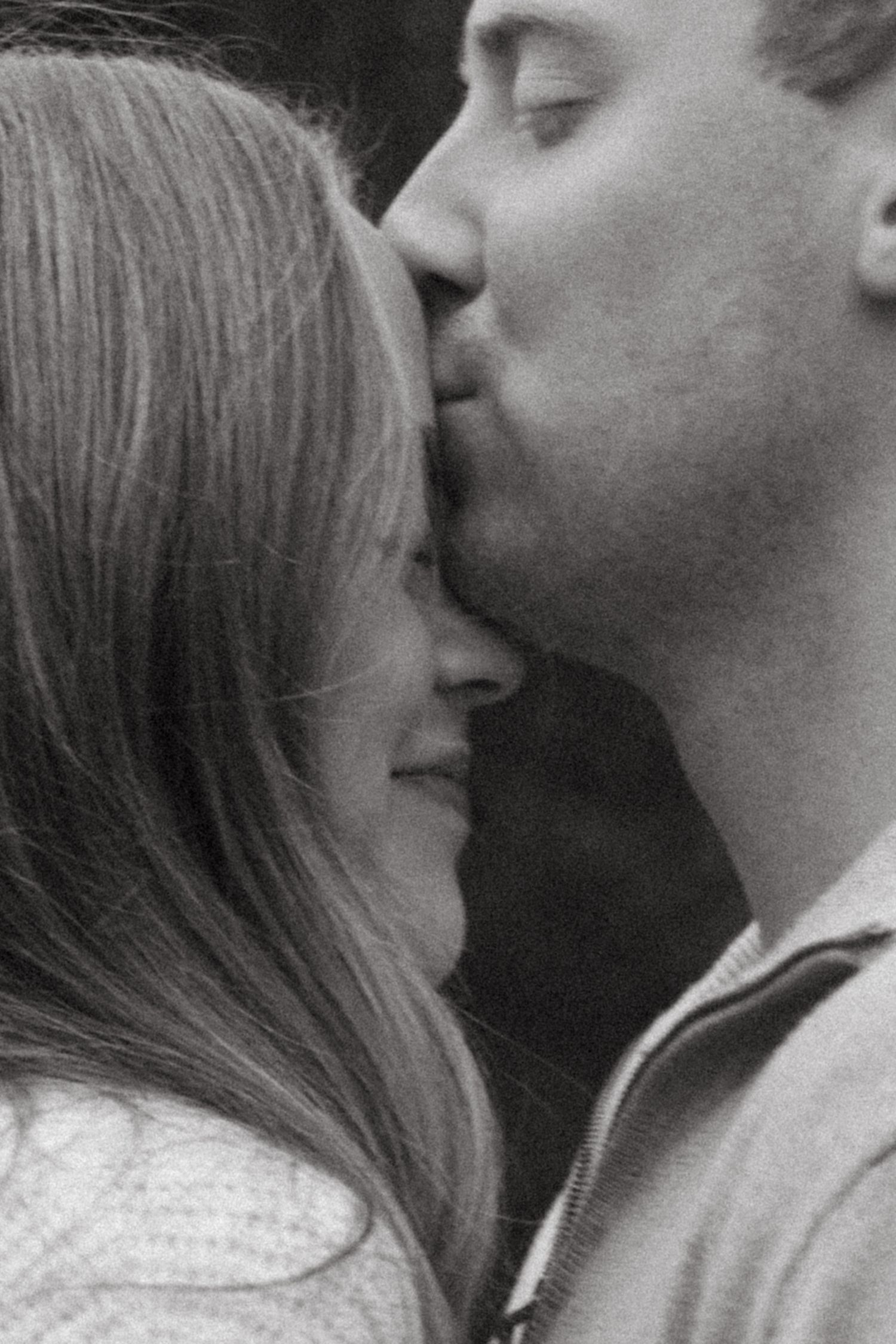 A black and white photo sequence shows two people in profile leaning in close together in an intimate moment.