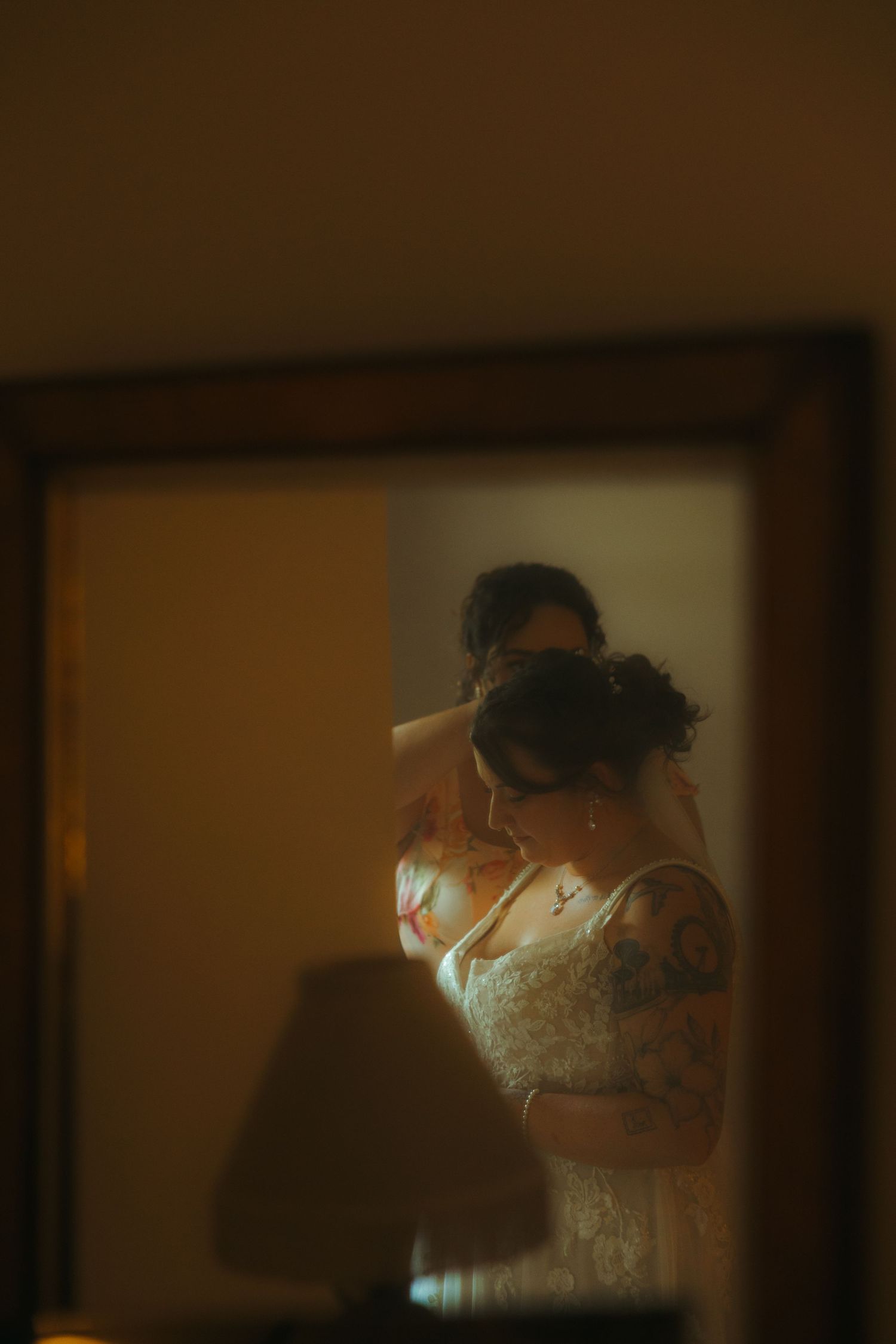A sequence of photos shows someone in a white wedding dress getting ready in a dimly lit room.