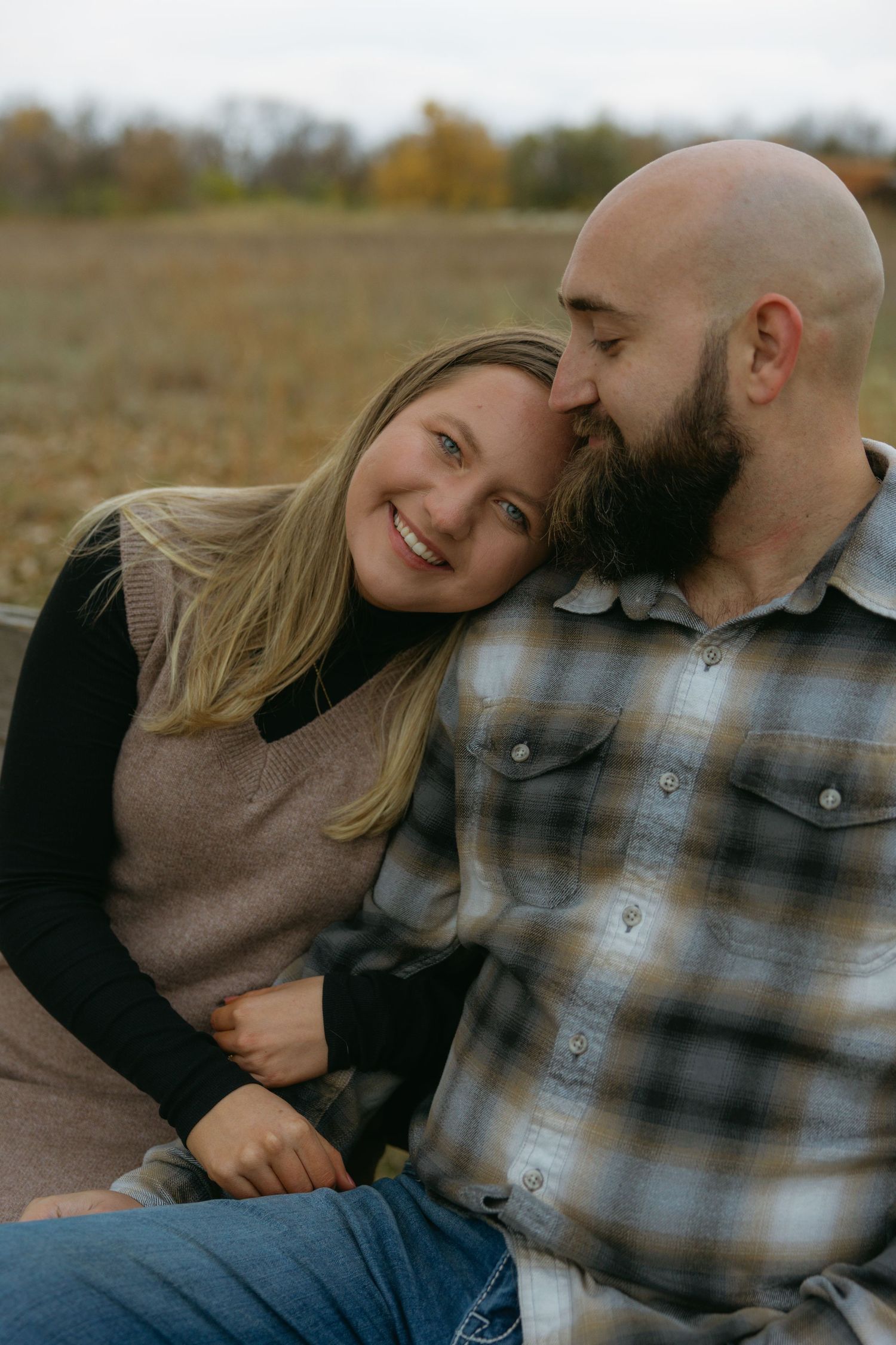 A couple in casual clothing sharing intimate moments outdoors in a series of romantic candid photos.