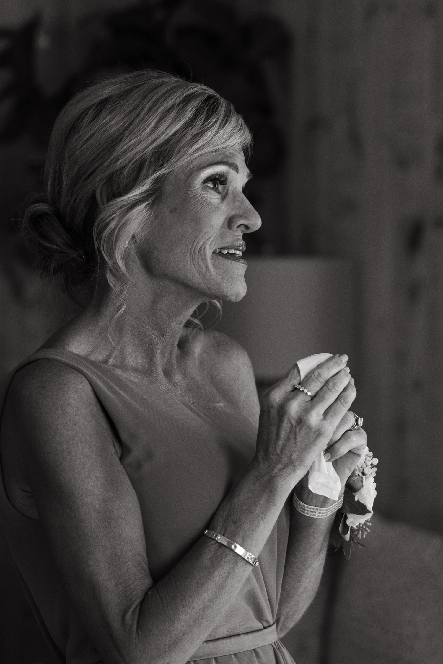 Black and white photo sequence showing a person laughing heartily in five progressive candid moments.