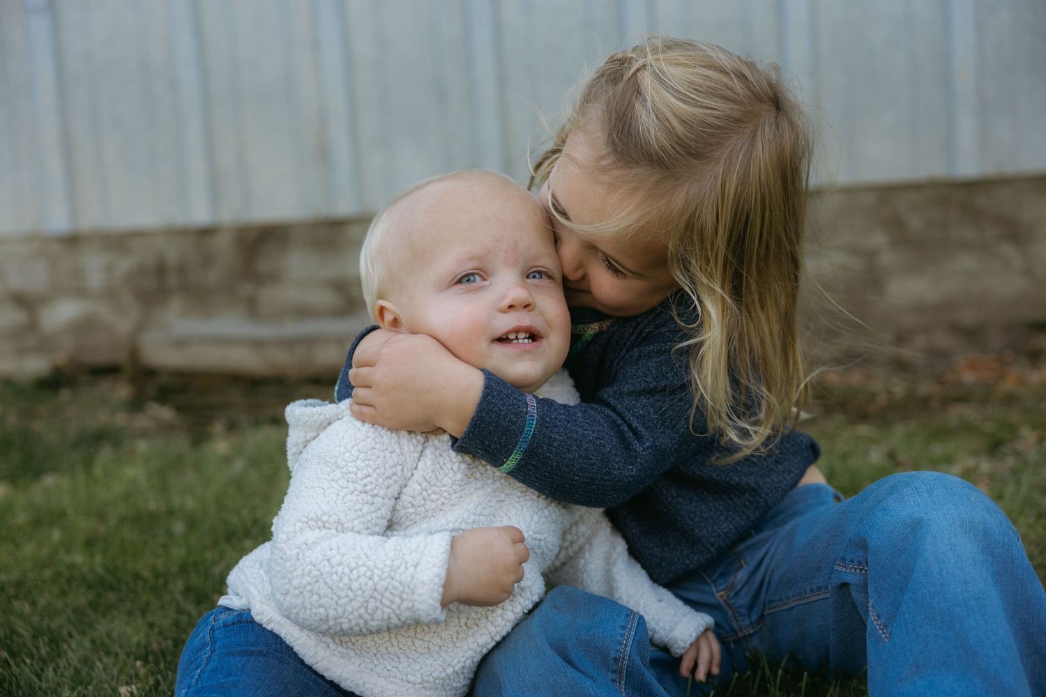 A sweet family moment captured in a series of candid outdoor photos showing affection and connection.