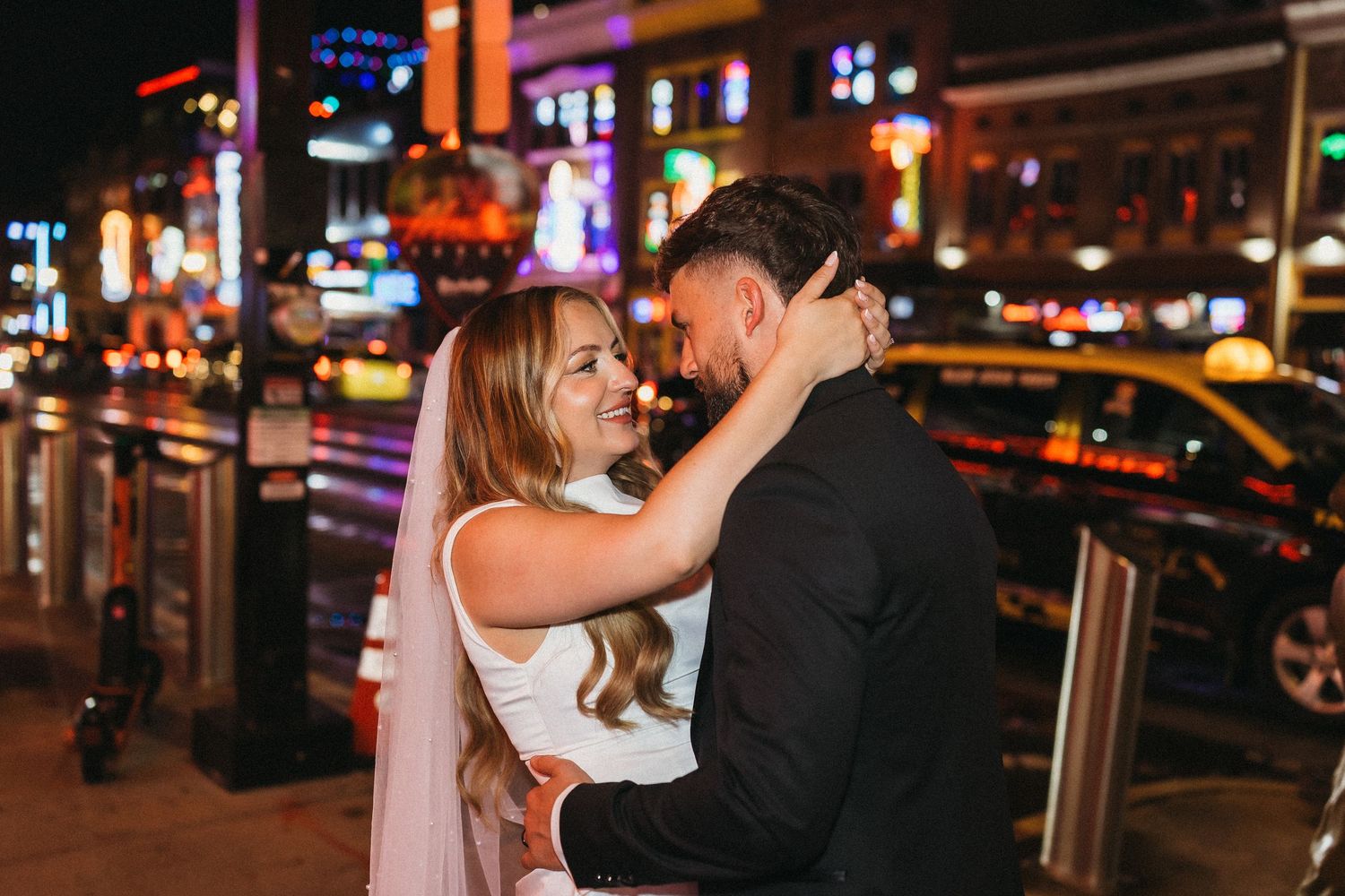 elope Nashville Photographer broadway celebration downtown elopement couple neon lights