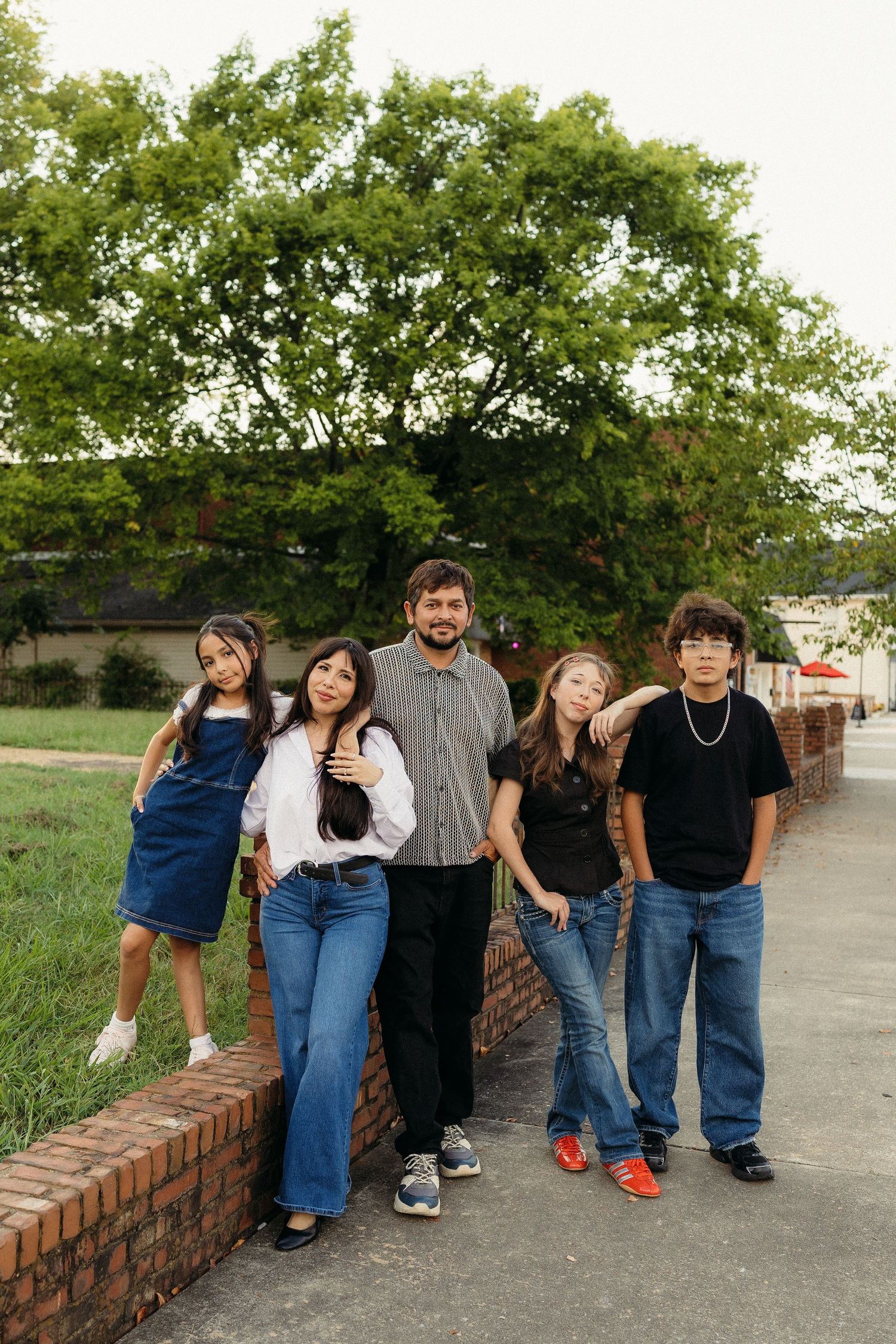 family photographer based, family posed everyone looking at the camera