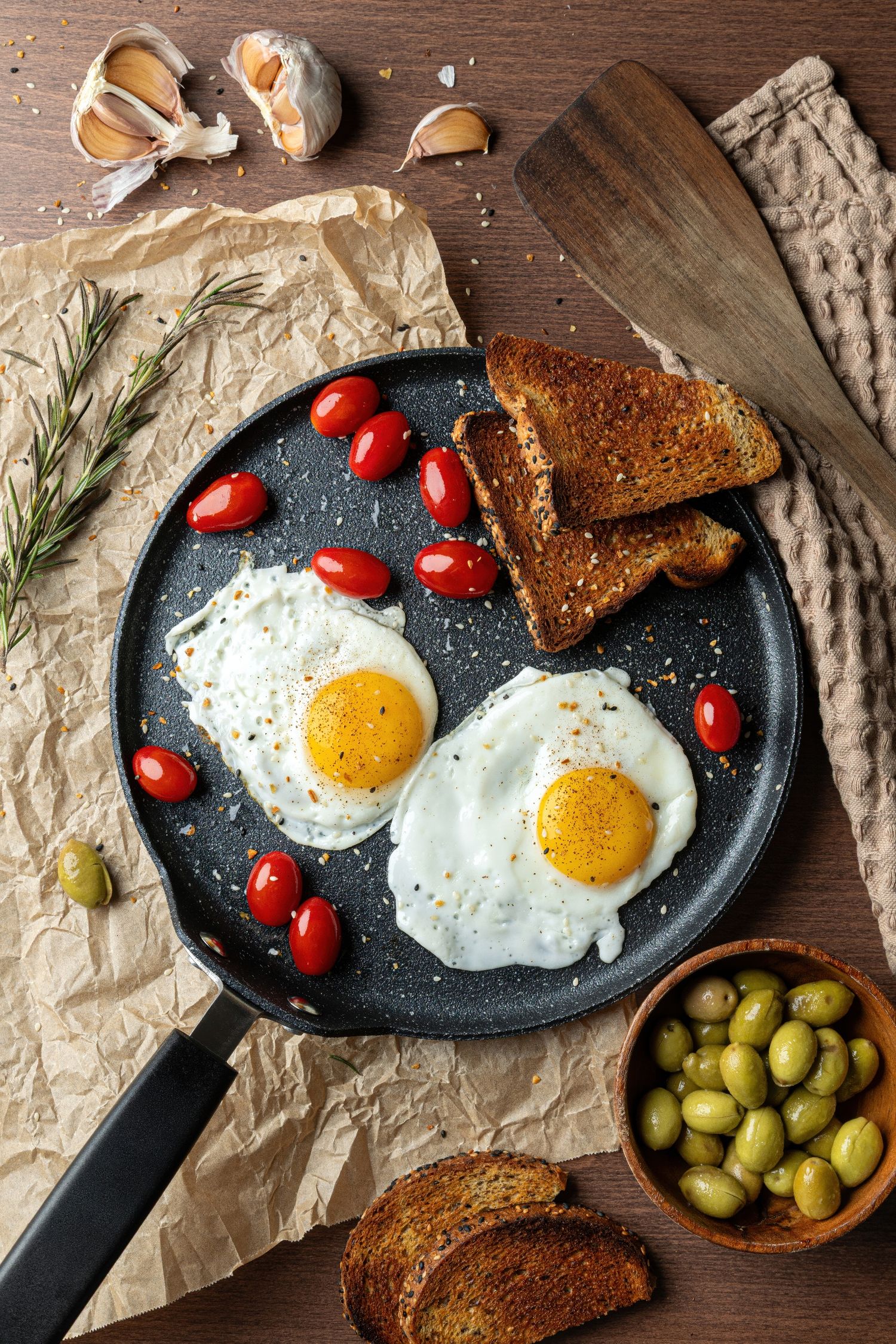 Sunny side up eggs and toast breakfast photography with olives, created for restaurant content.