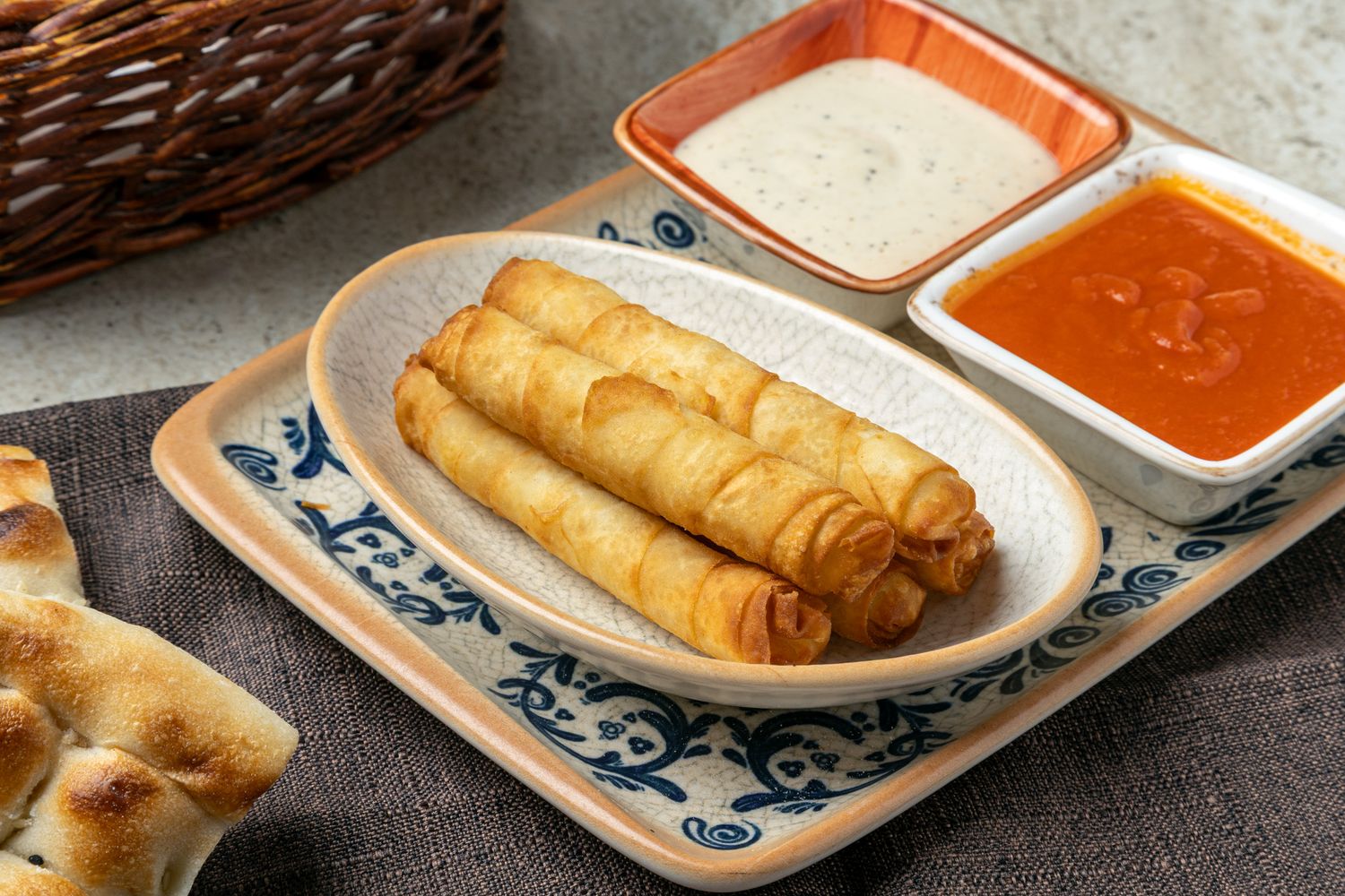 Food photography of Golden crispy cheese rolls.