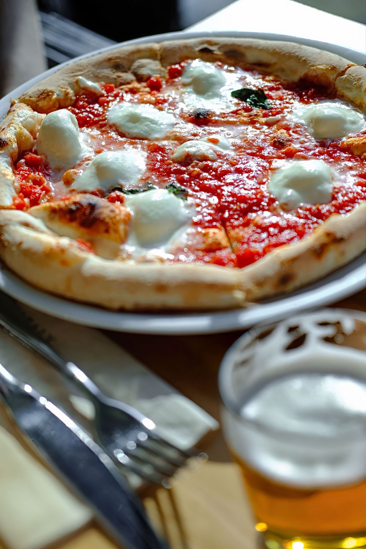 Authentic Margherita pizza photography shot for commercial food photography and social media video content.