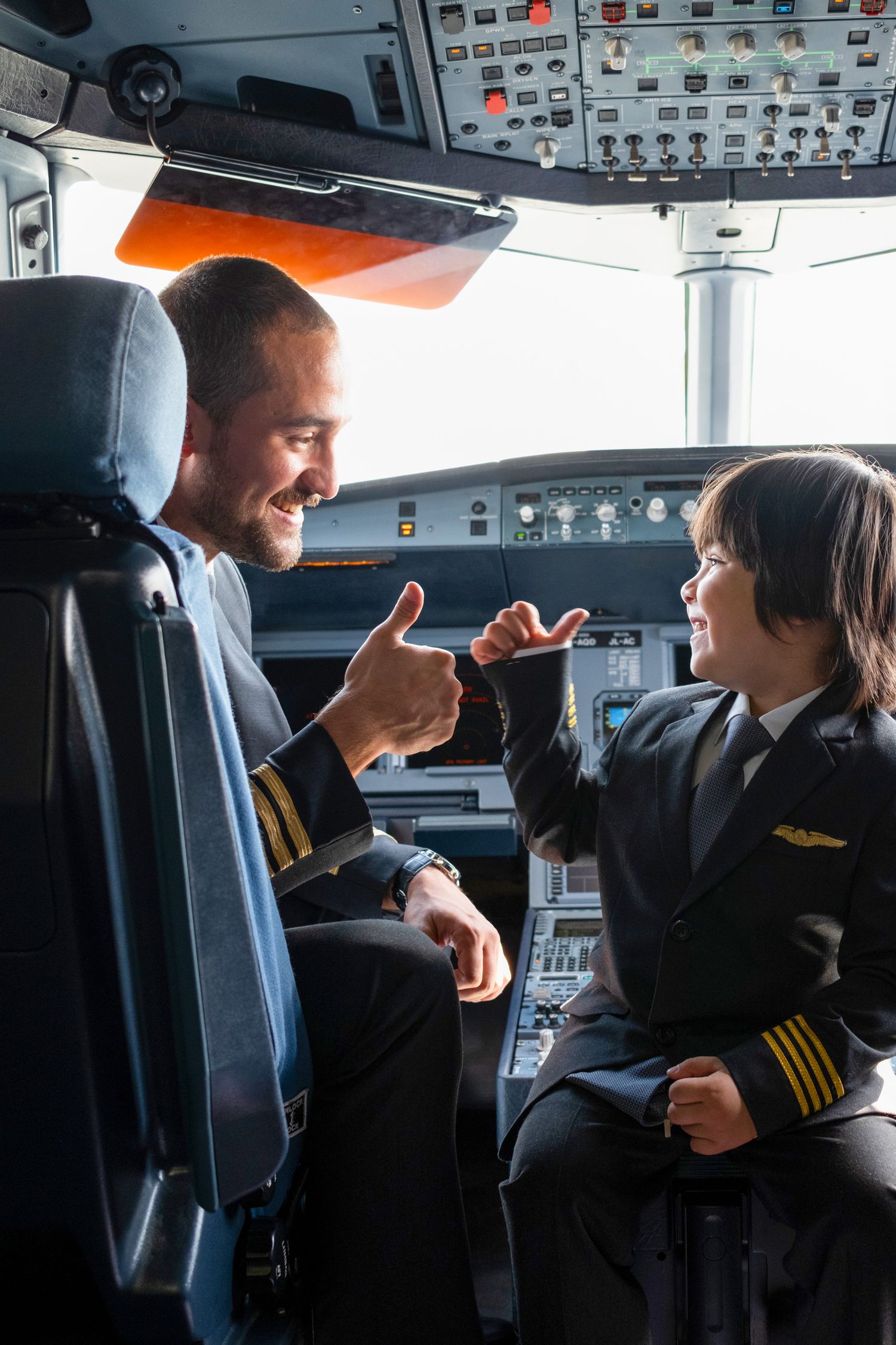 Pilot engaging with child inside aircraft cockpit created for aviation creative photography with educational content