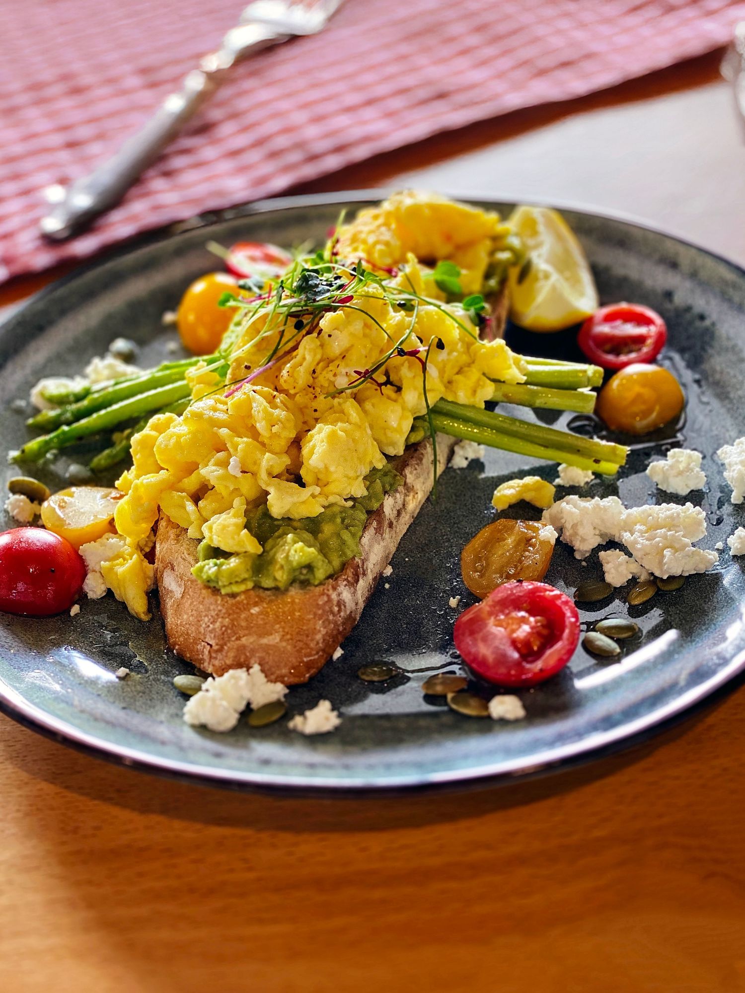 Brunch photography of scrambled eggs on toast with avocado produced for social media creative content.
