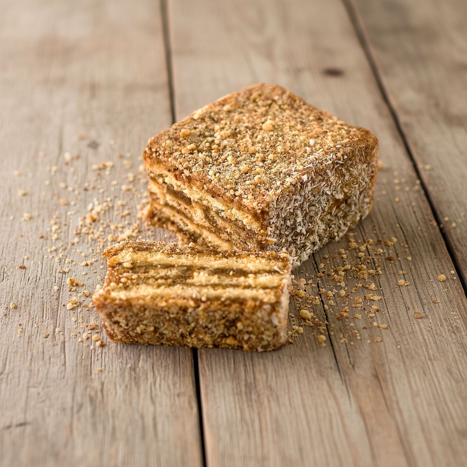 Dessert photography of stacked date bars with texture shot for restaurant menu and social content.