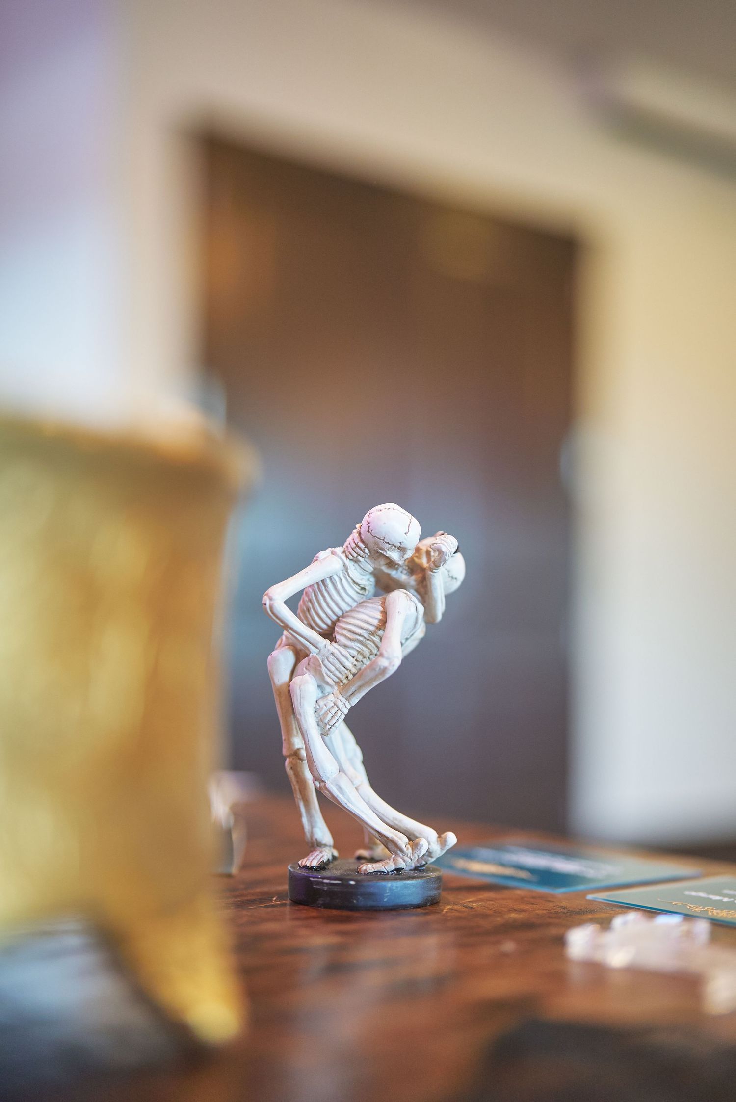Stop motion sequence of small figurines bending down in progression.