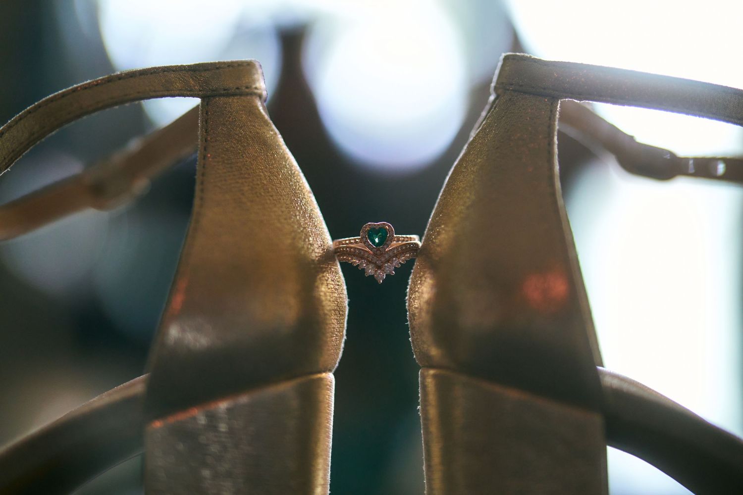 Close-up detail of leather dress shoes with delicate buckle fastening.