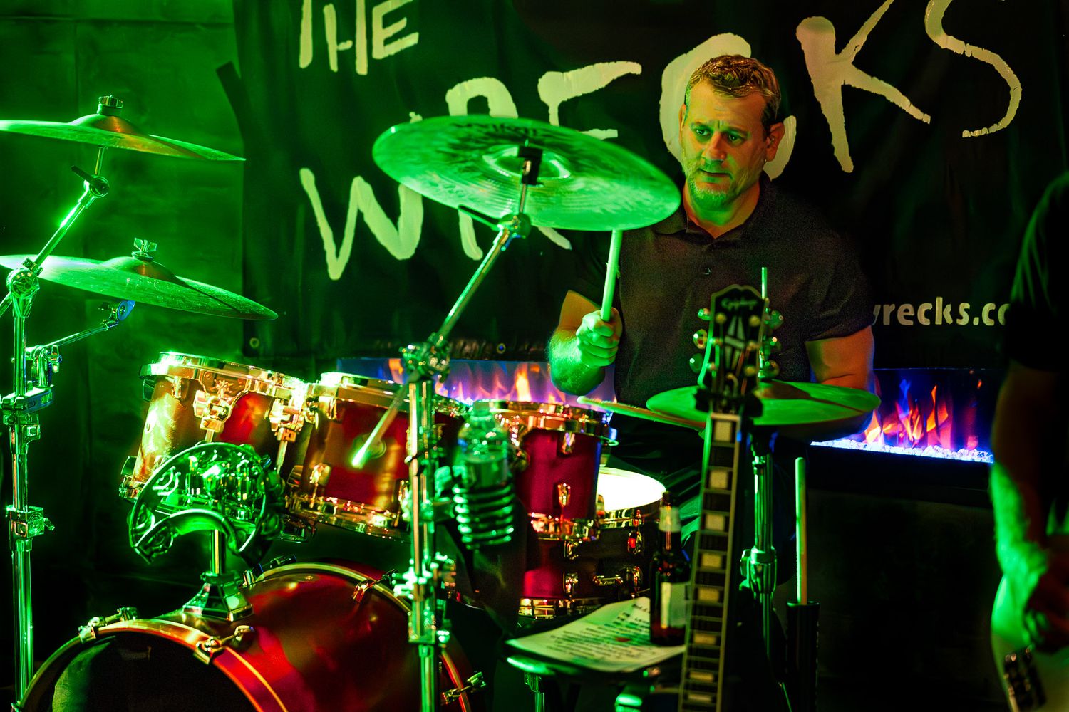 Drummer performing live with The Wrecks in a small venue.