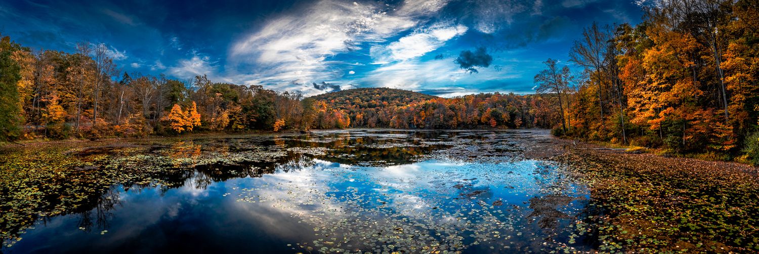 Drone panorama of Ghost Lake off Shades of Death Road in Great Meadows, New Jersey during fall.