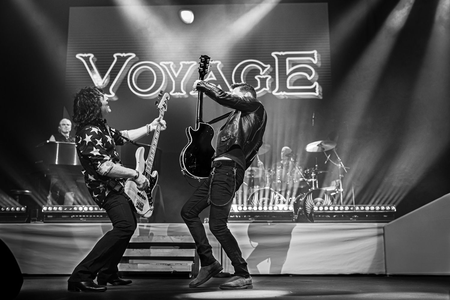 Members of Voyage, the National Journey Tribute Band, performing live on stage at Wind Creek Event Center in Bethlehem, PA.