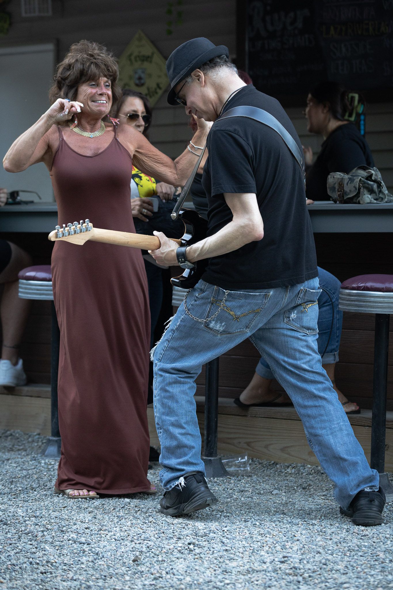 Audience member interacting with guitarist during an outdoor performance by The Wrecks.