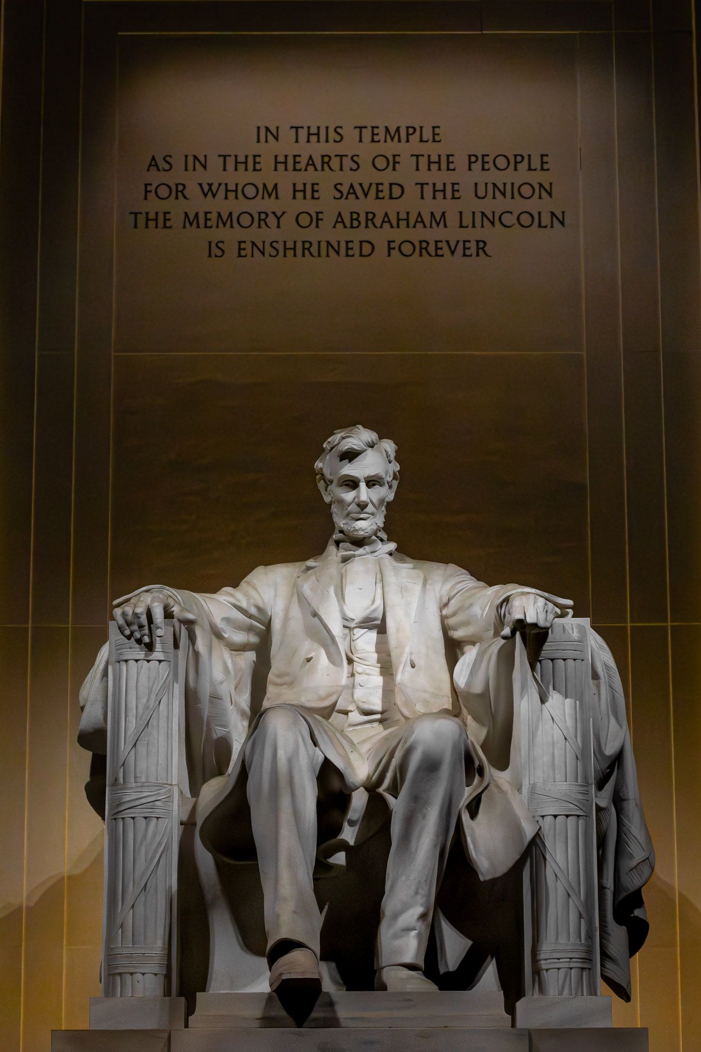 Abraham Lincoln statue at the Lincoln Memorial with memorial inscription
