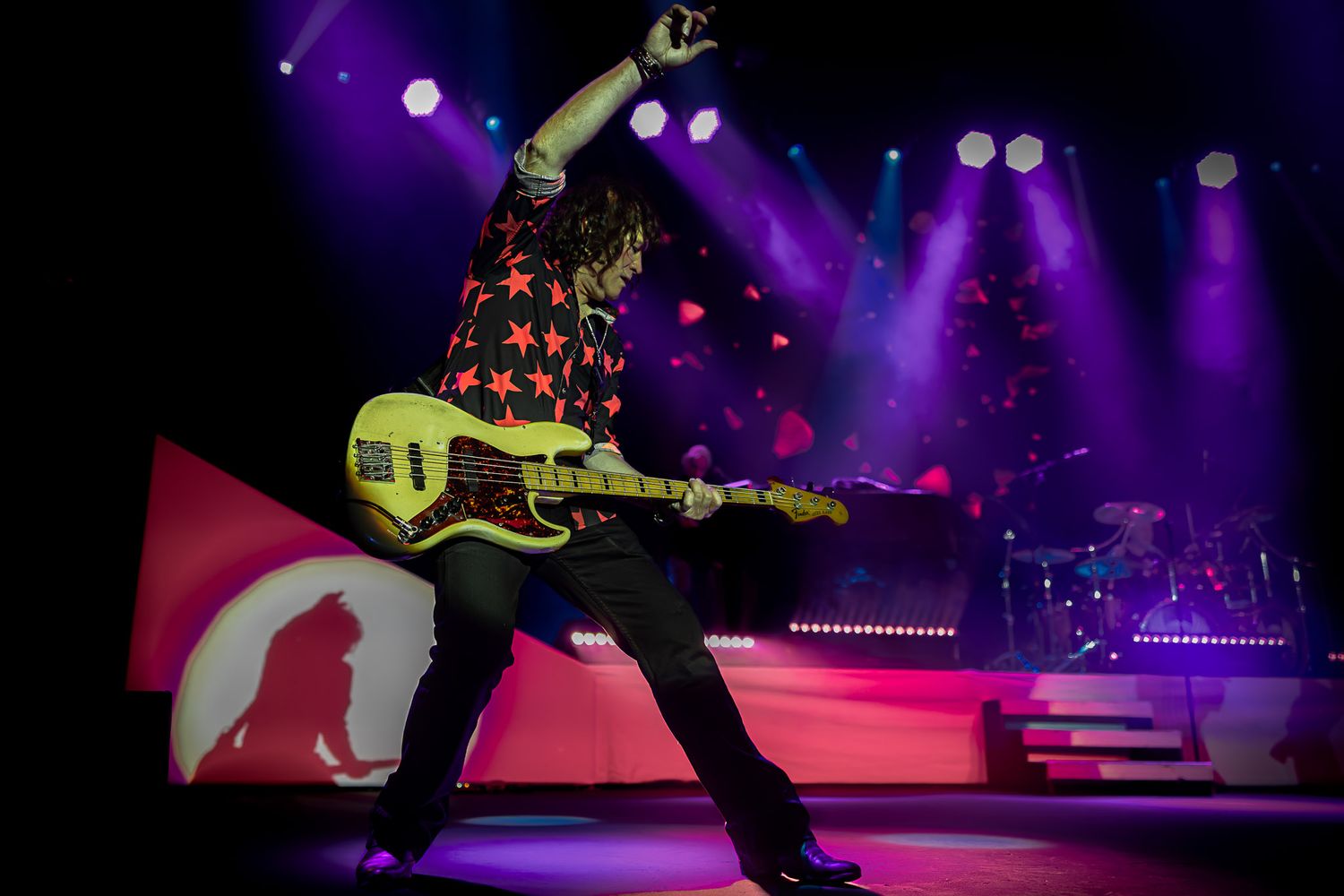 Bassist of Voyage performing live on stage at Wind Creek Event Center in Bethlehem, PA.