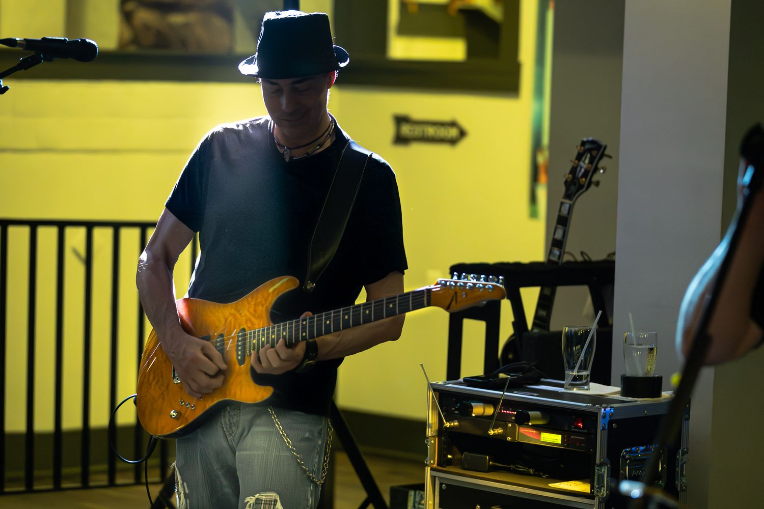 Guitarist performing live with The Wrecks at a small venue.