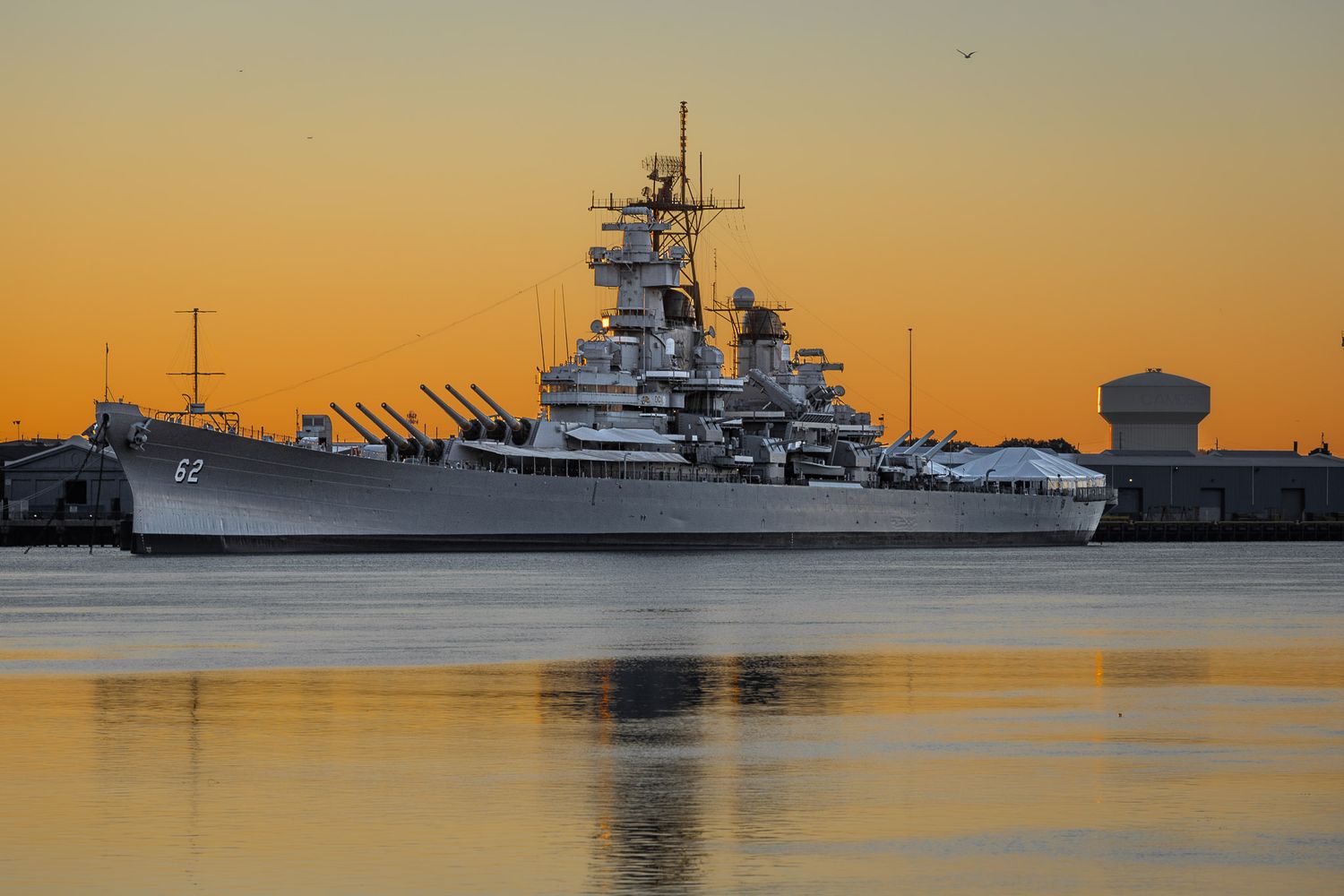 USS New Jersey BB-62 battleship at dawn on the Delaware River viewed from Philadelphia PA
