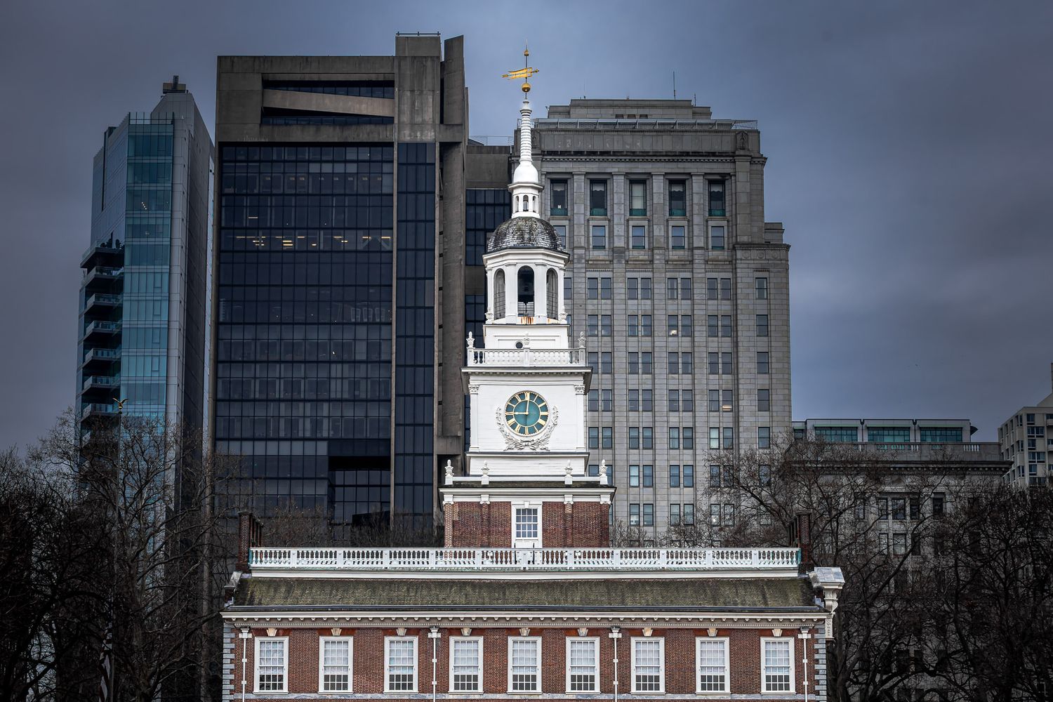 Independence Hall clock tower in Philadelphia Pennsylvania with modern city skyline