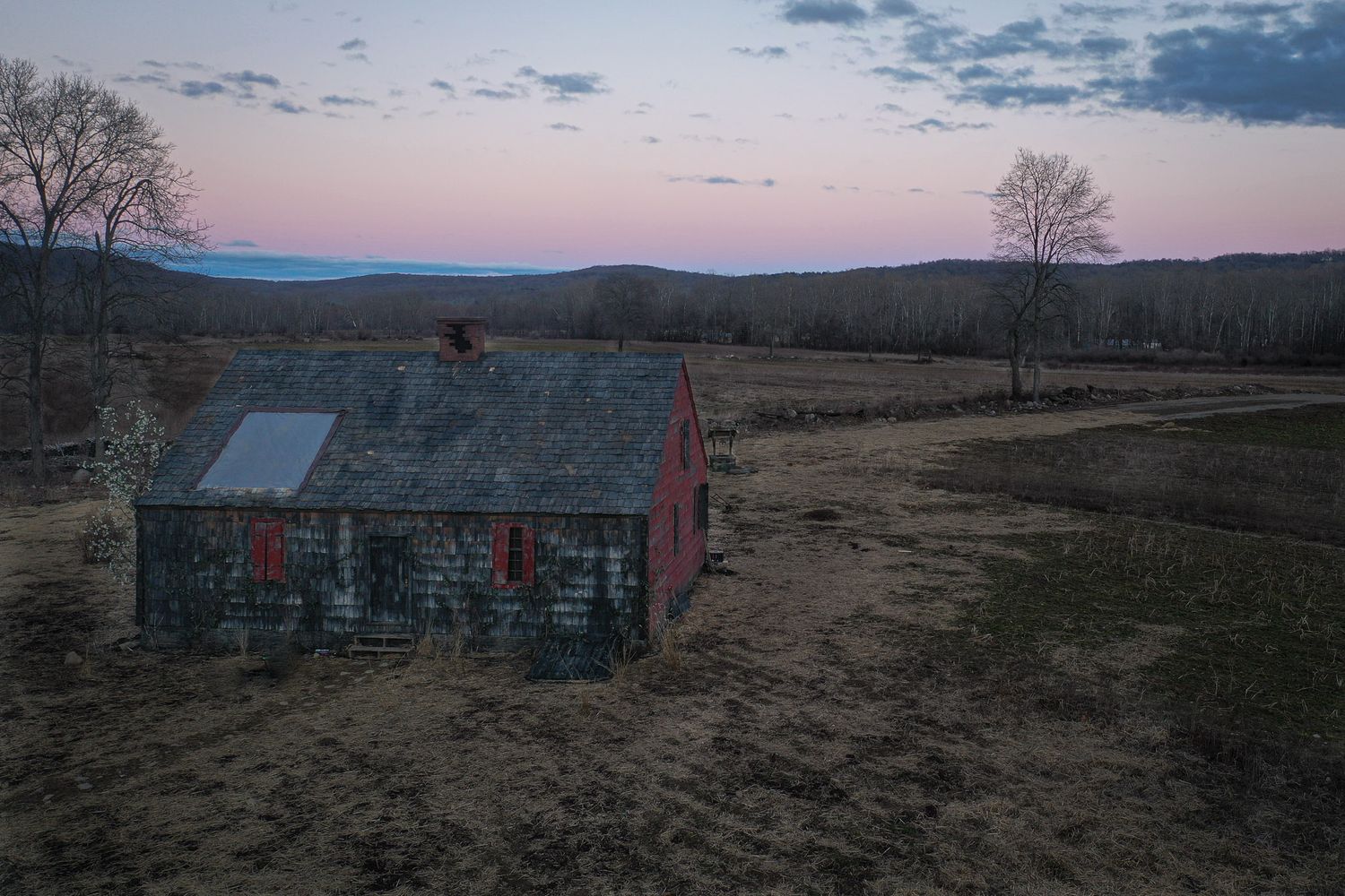 Aerial view of temporary farmhouse film set in Great Meadows NJ at dusk