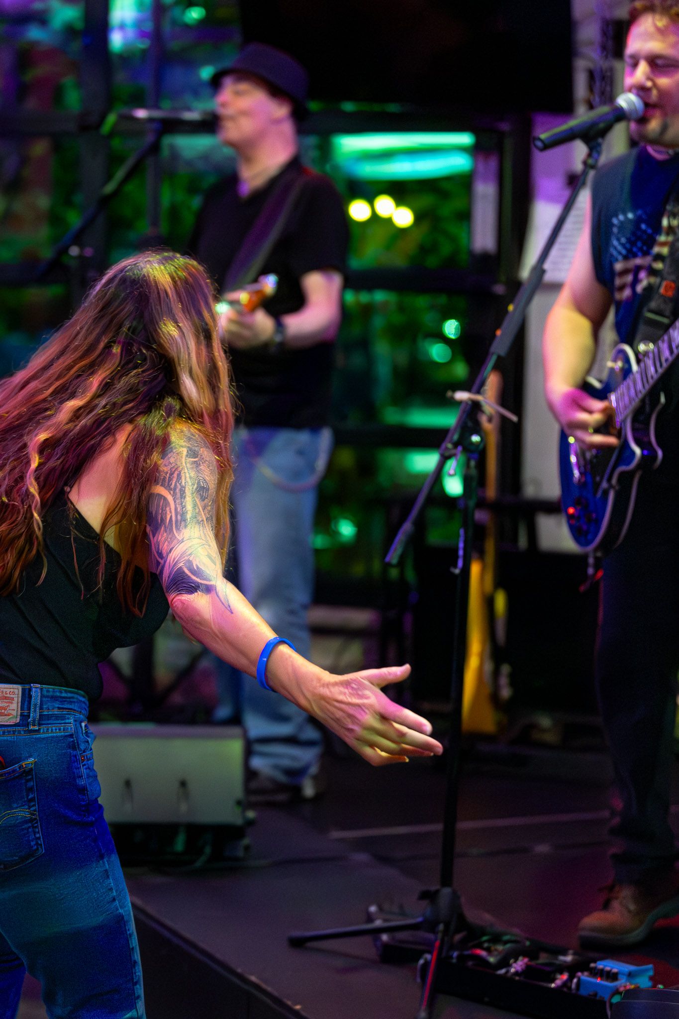 The Wrecks live performance with an audience member dancing near the stage.
