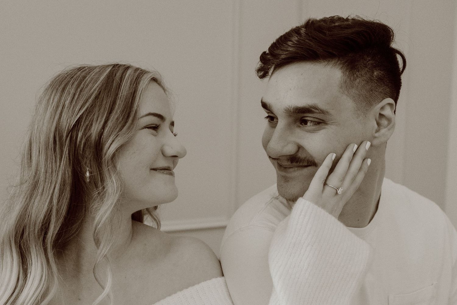 A romantic black and white photo series showing tender emotional moments between a couple in various poses.