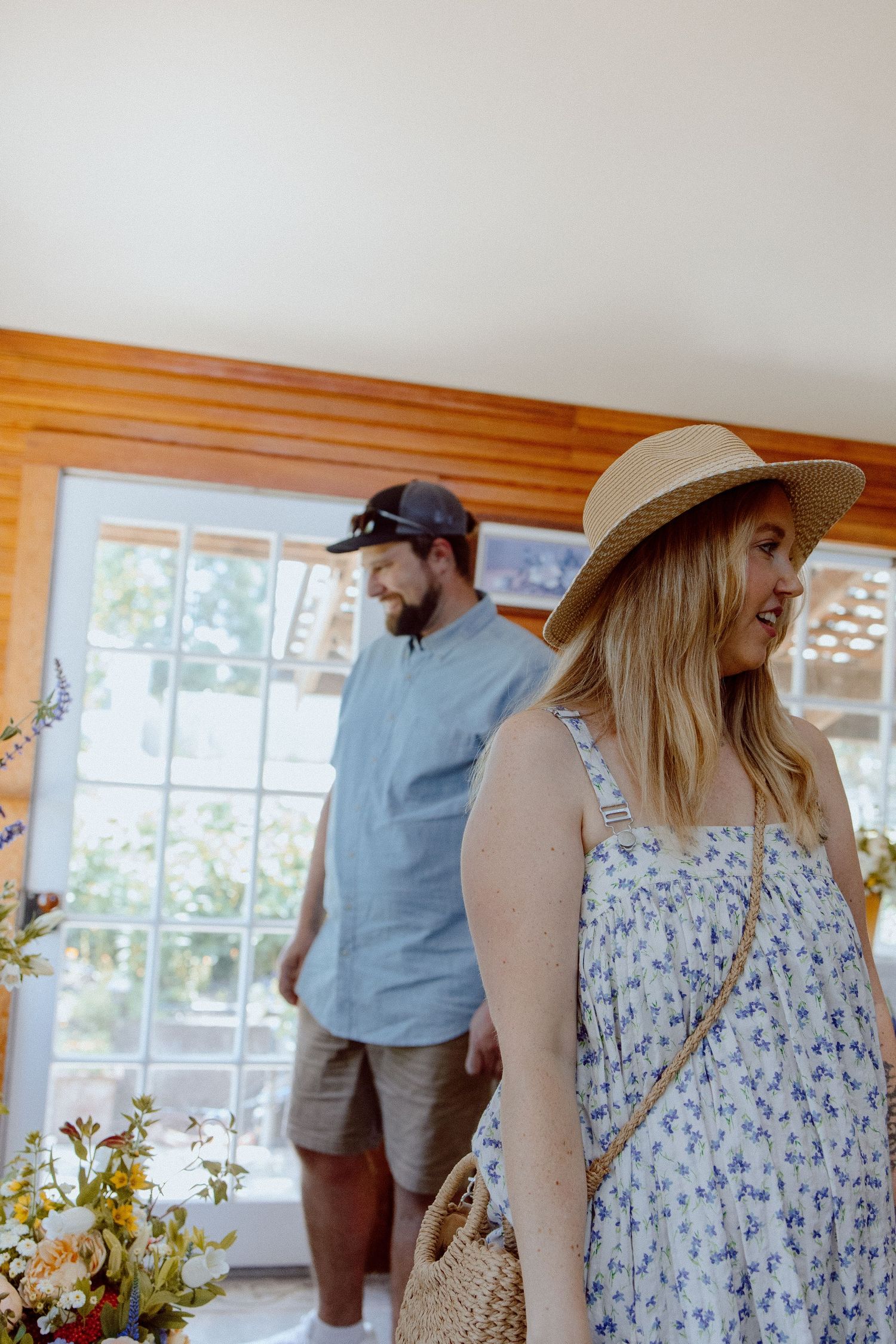 Four connected interior photos showing people in casual summer attire walking through a sunny flower shop with windows.