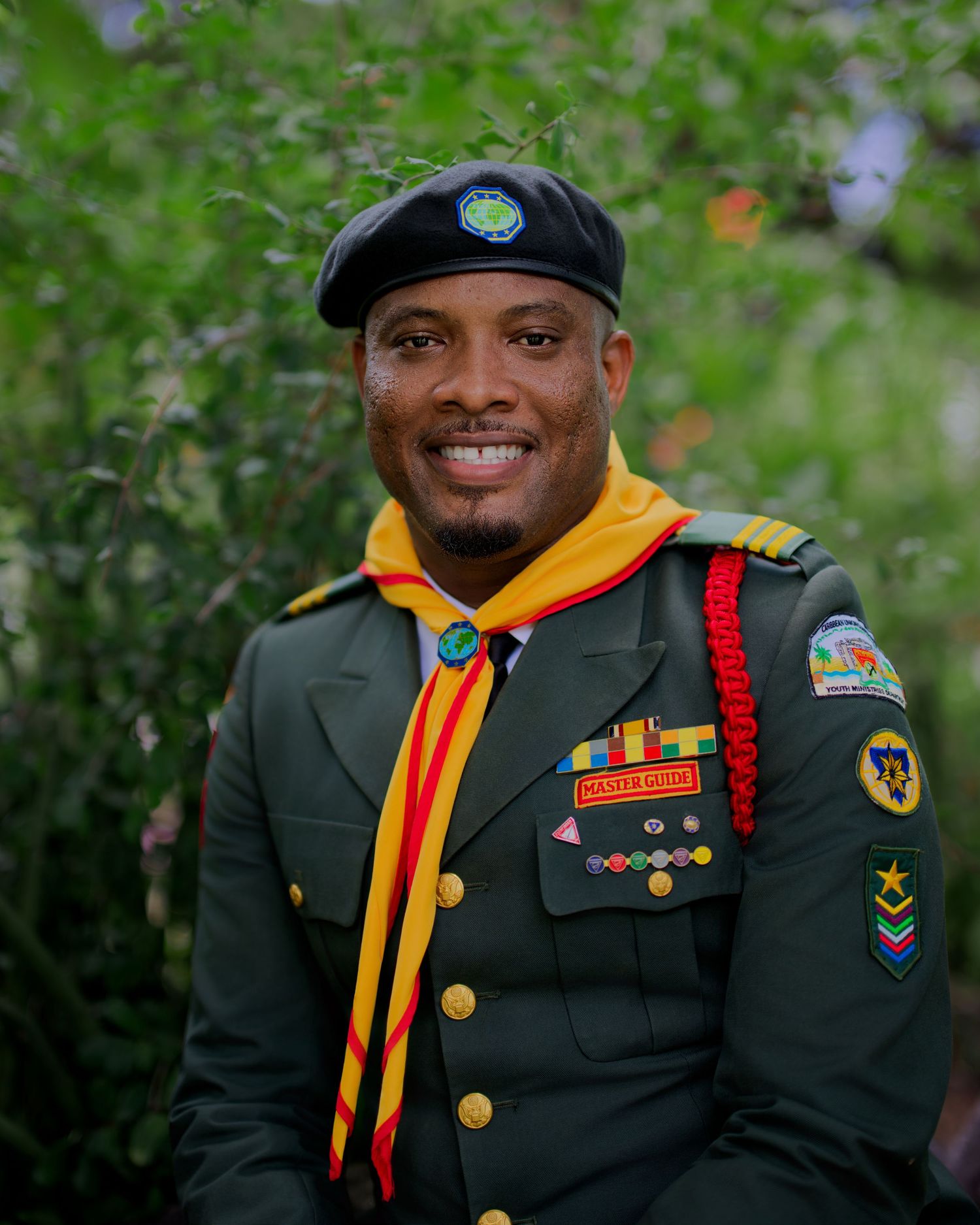 Military service members in dress uniforms with medals and patches.