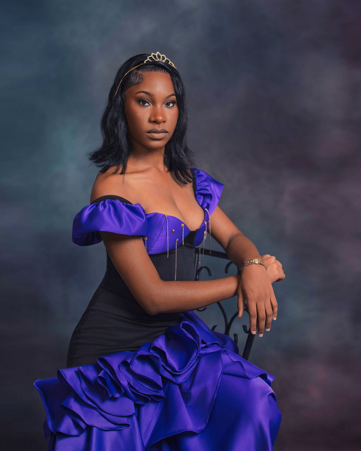 A stunning portrait series in a vibrant royal purple gown against a dramatic dark background.