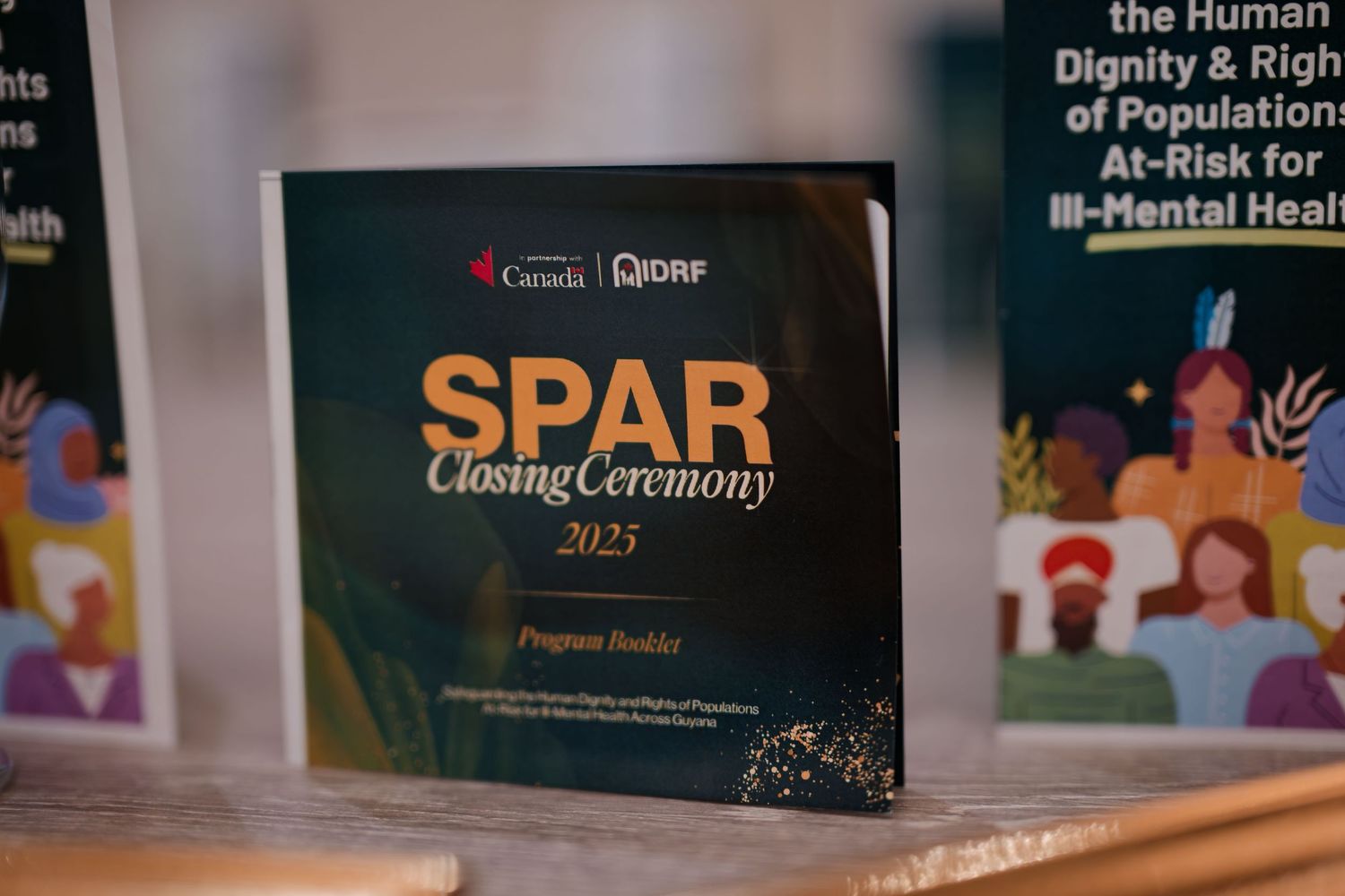 SPAR Closing Ceremony 2025 program booklet displayed at an event hosted by Canada and JDRF.