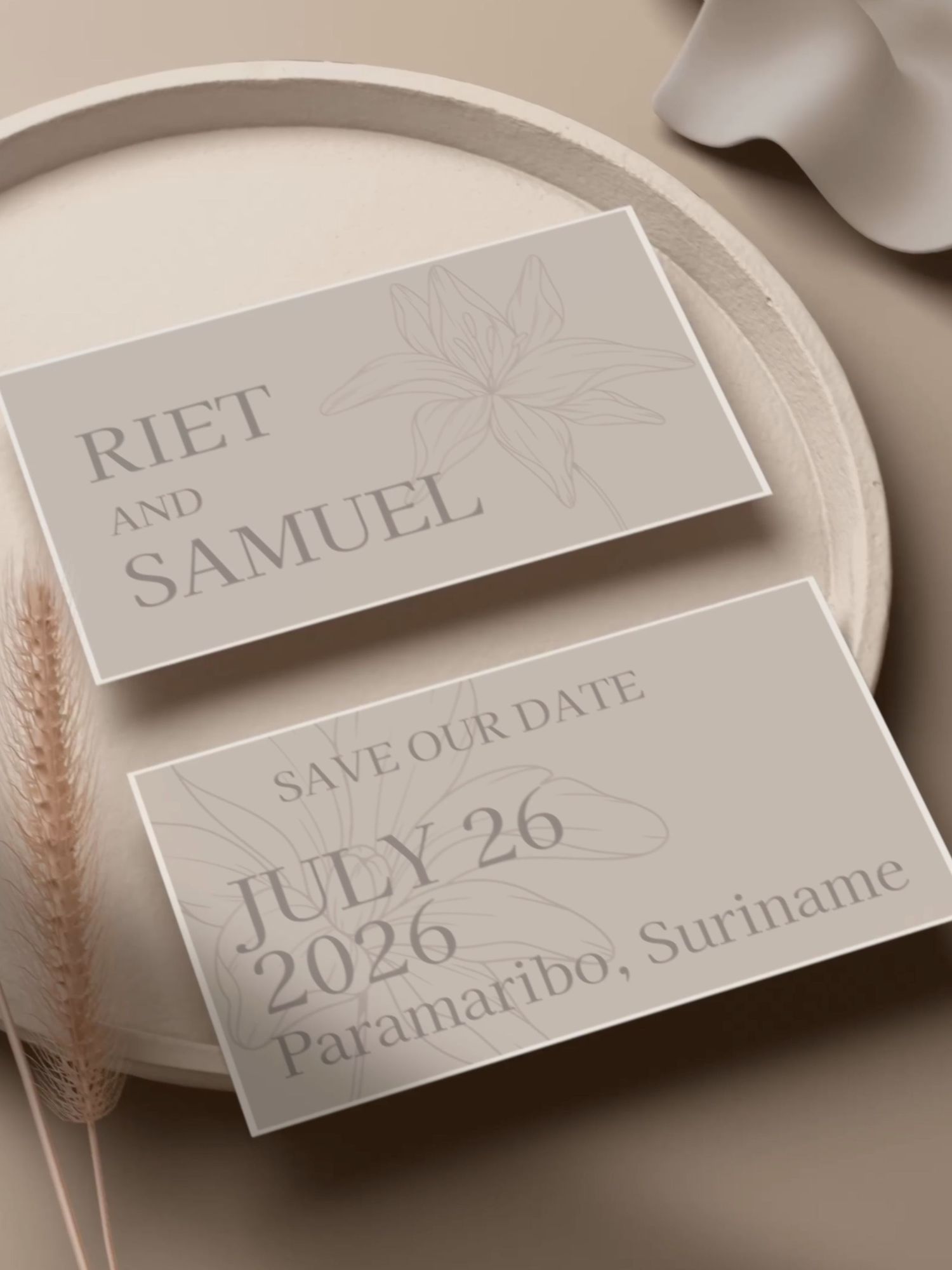 Elegant wedding place cards in light gray with minimalist text and wheat stalks on a neutral background.