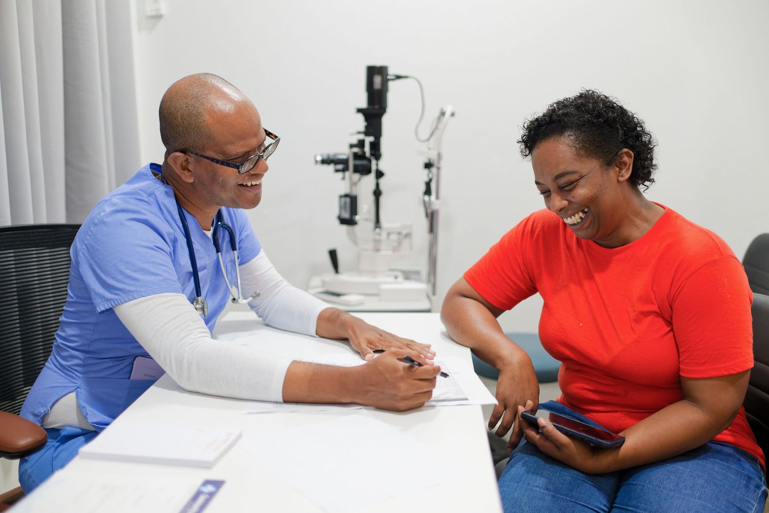 Healthcare providers conducting patient consultations in a medical office.