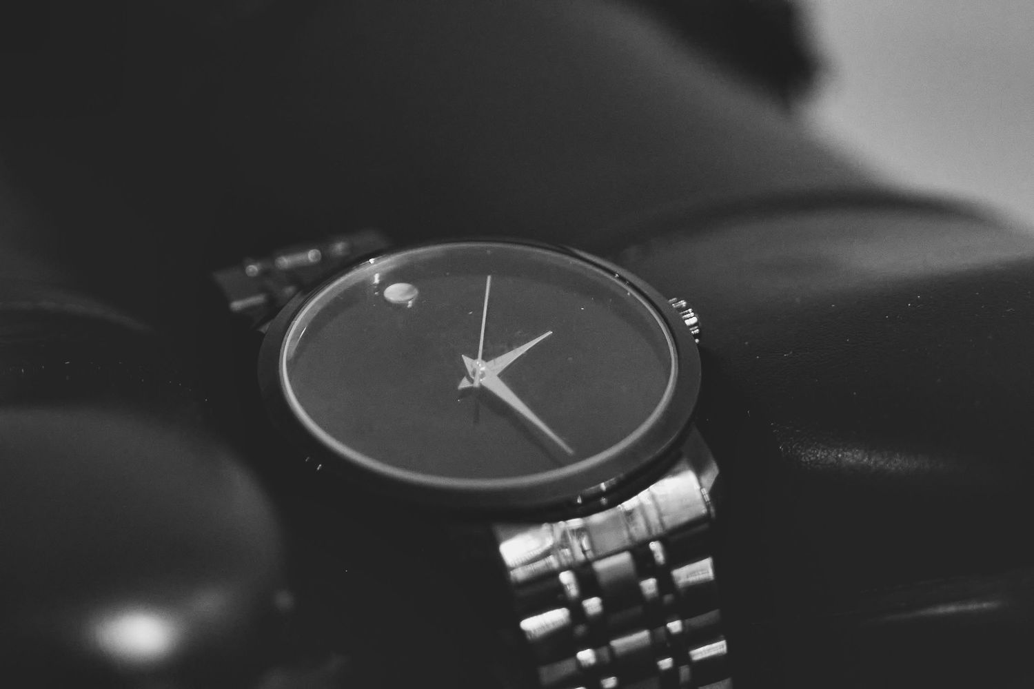 Wedding details including rings, watches, and jewelry captured in elegant black and white photography.