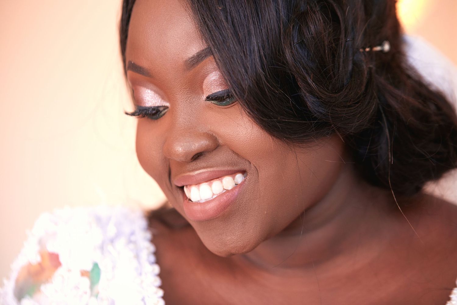 Close-up beauty shots showing radiant smiles and wedding day makeup.