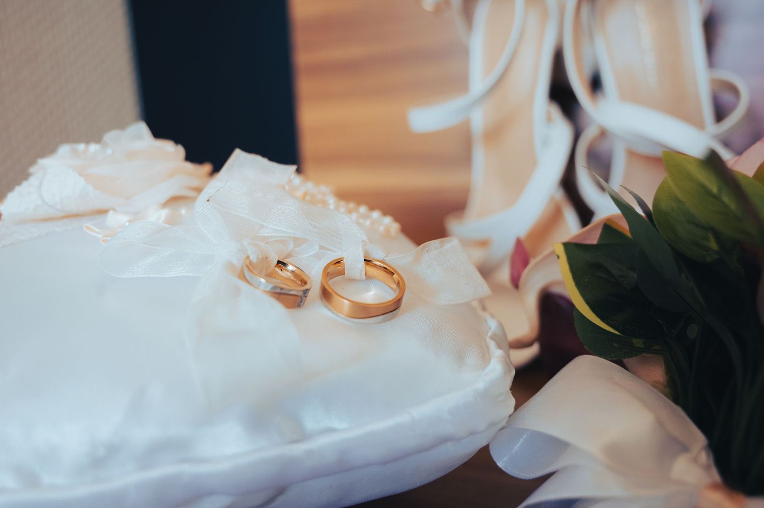 Close-up details of a delicate white lace wedding dress.