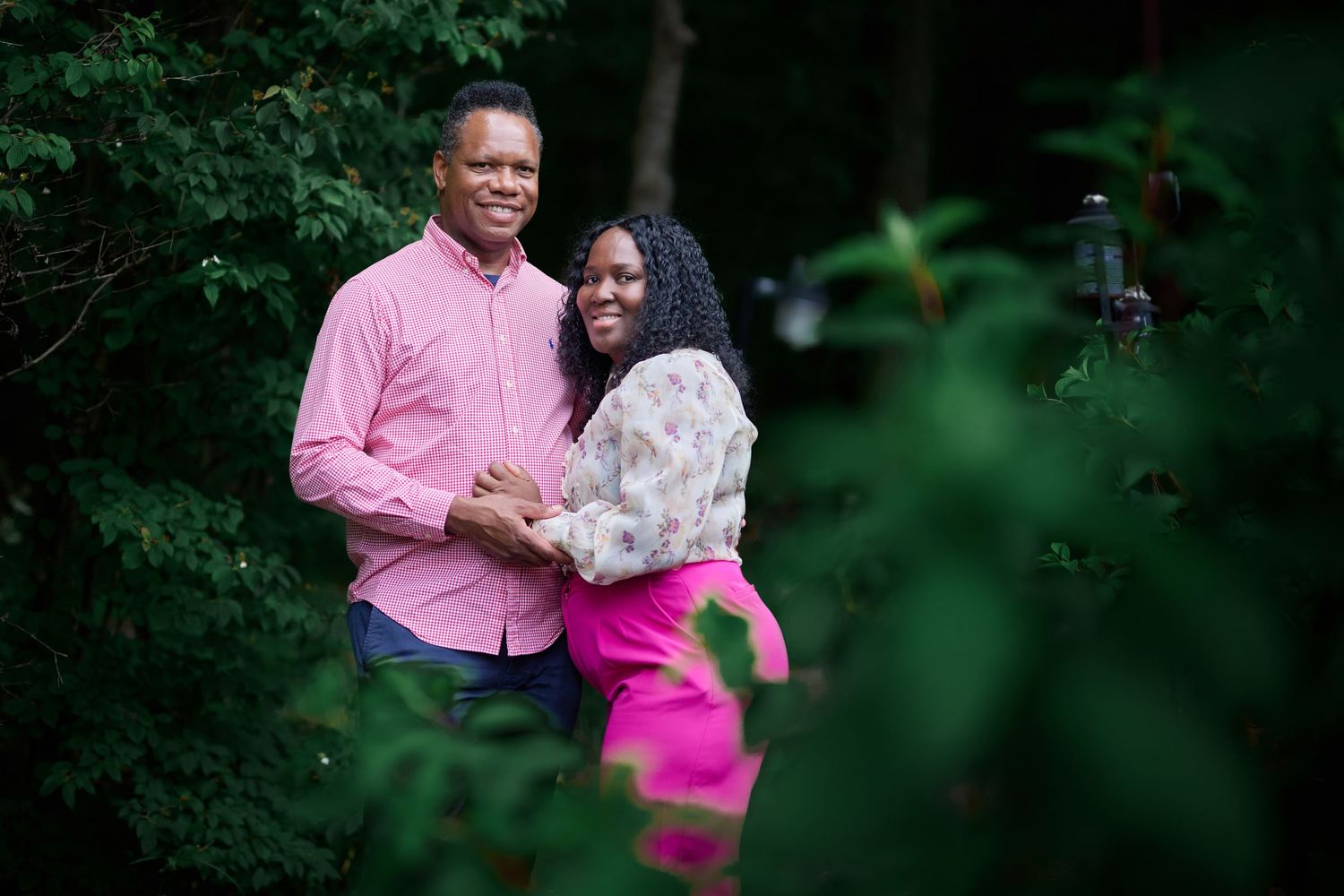 Intimate outdoor photography session with natural forest lighting.