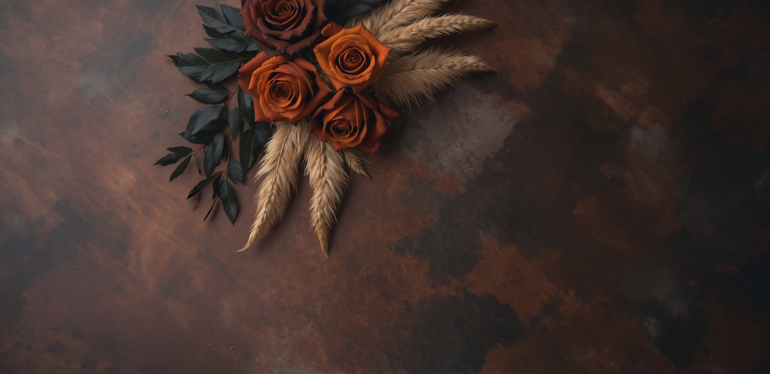 Dark moody floral arrangement with deep red roses against a black background creates dramatic contrast.