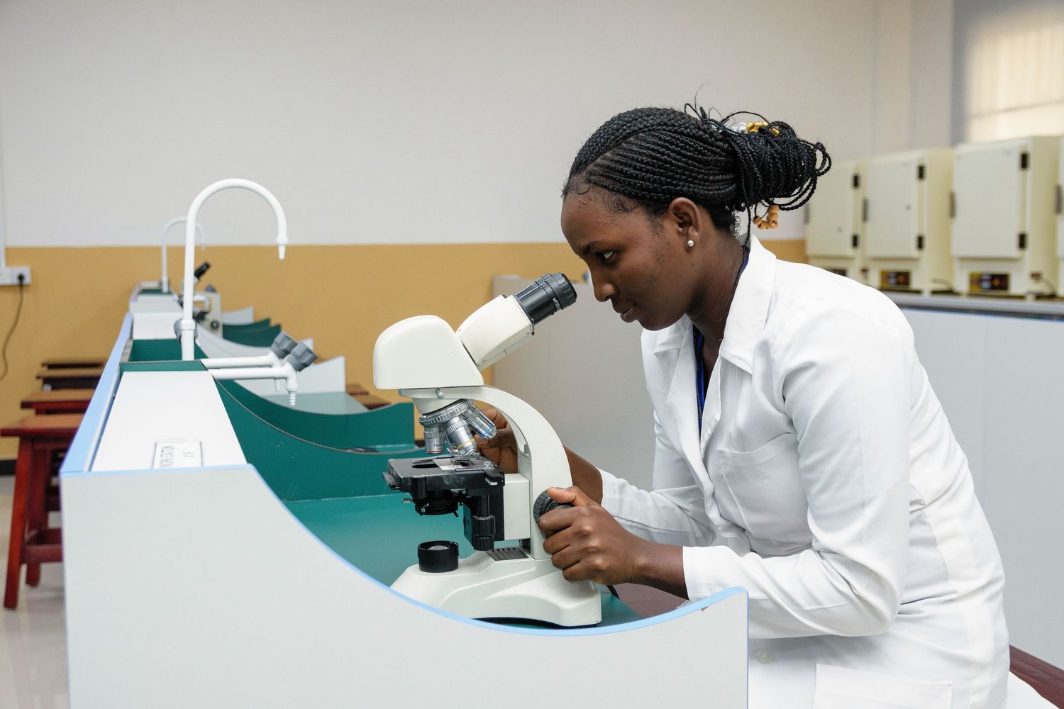 Researchers analyzing samples and performing tests in a clinical laboratory setting.
