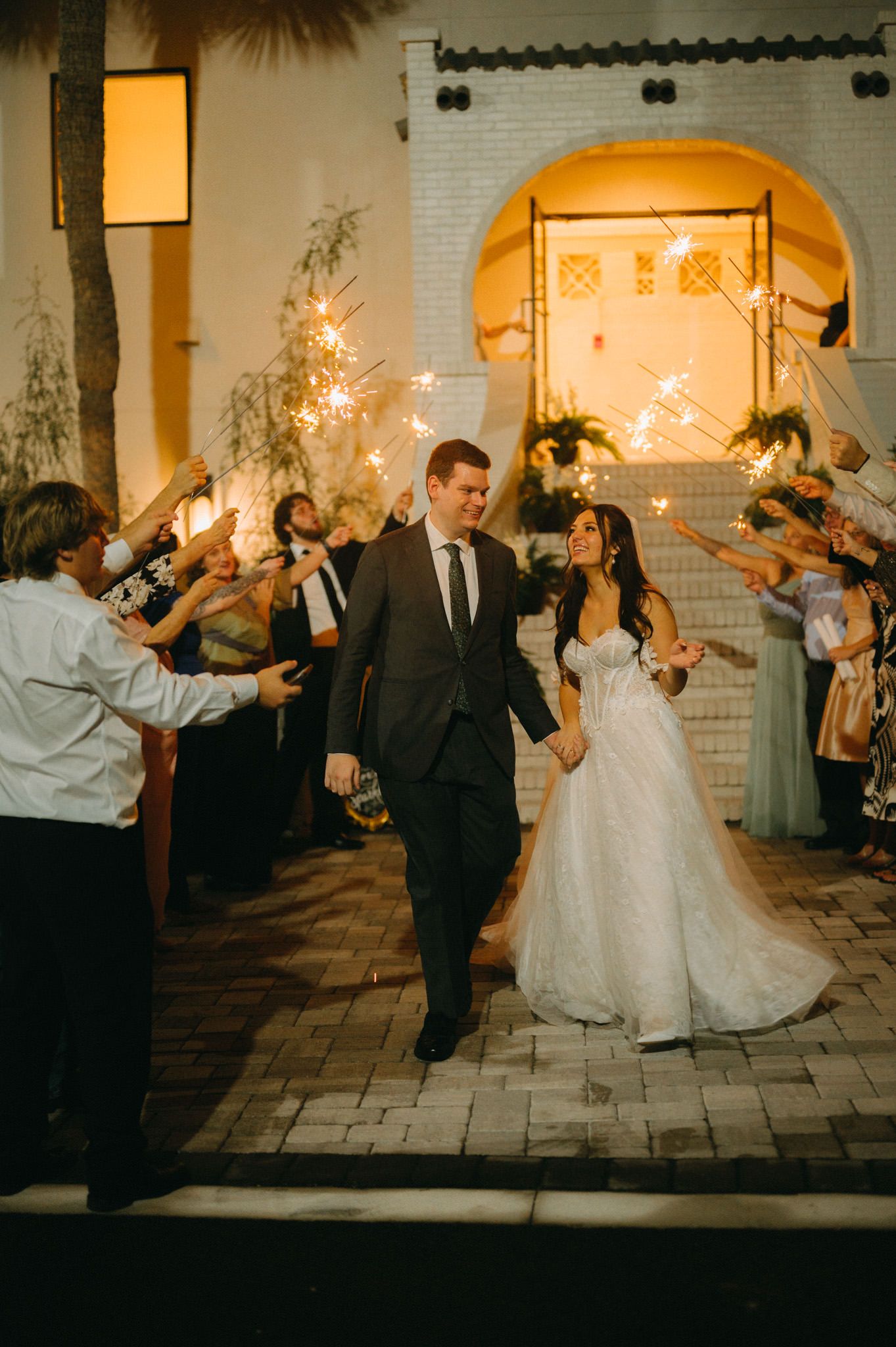 St. Augustine wedding photographer capturing the bride and groom during the sparkler exit at the end of the night.