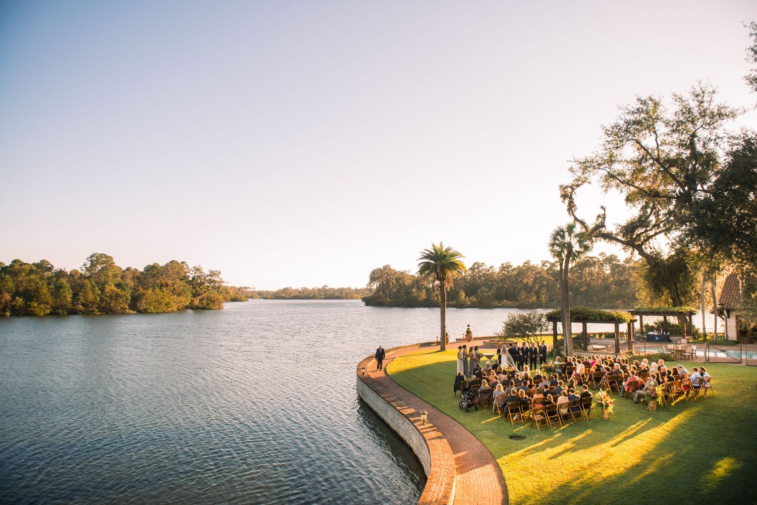 Scenic lakeside panorama with trees and water views at sunset shows multiple connected landscape shots.