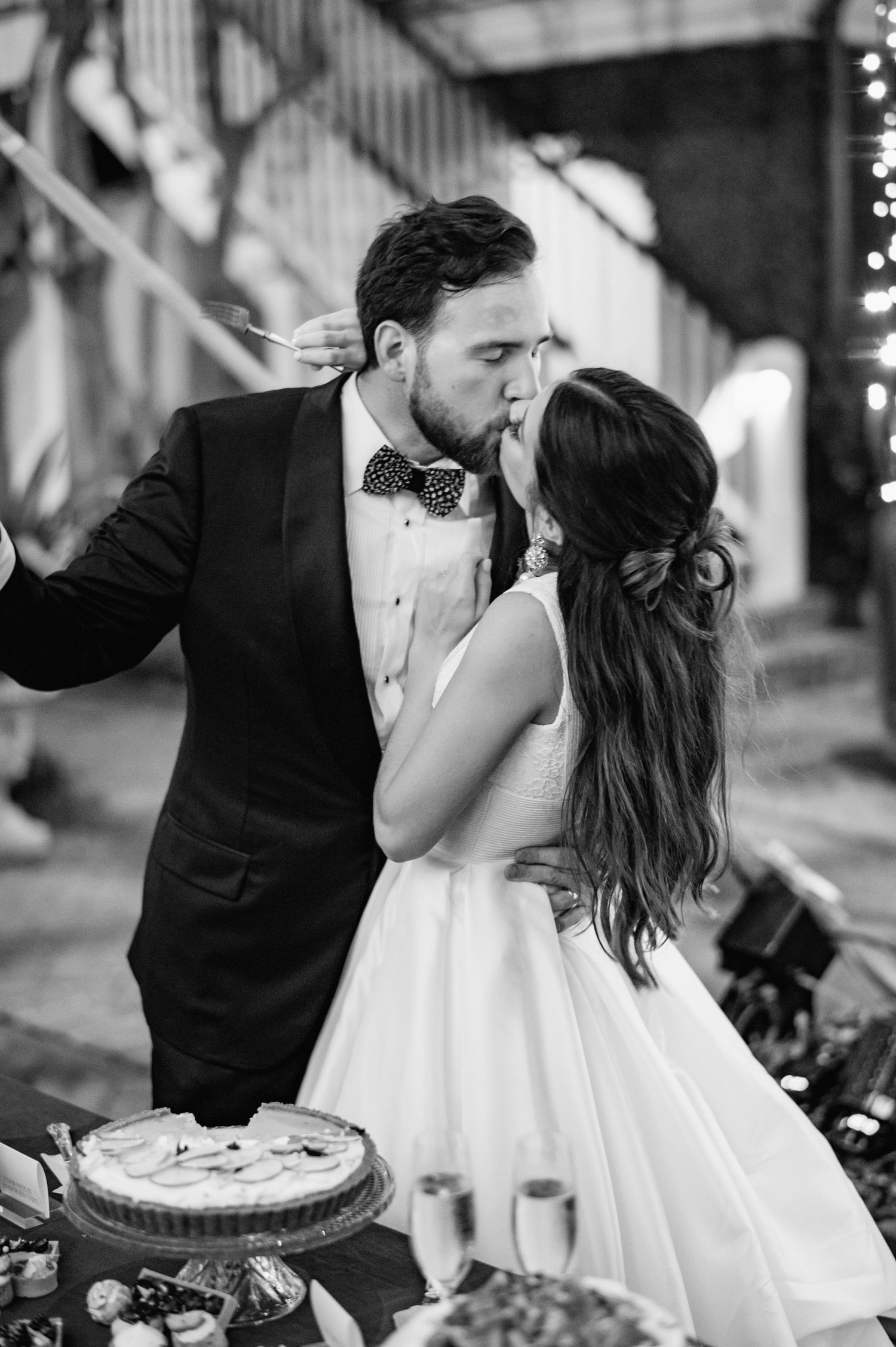 Intimate black and white wedding portraits captured during evening reception.