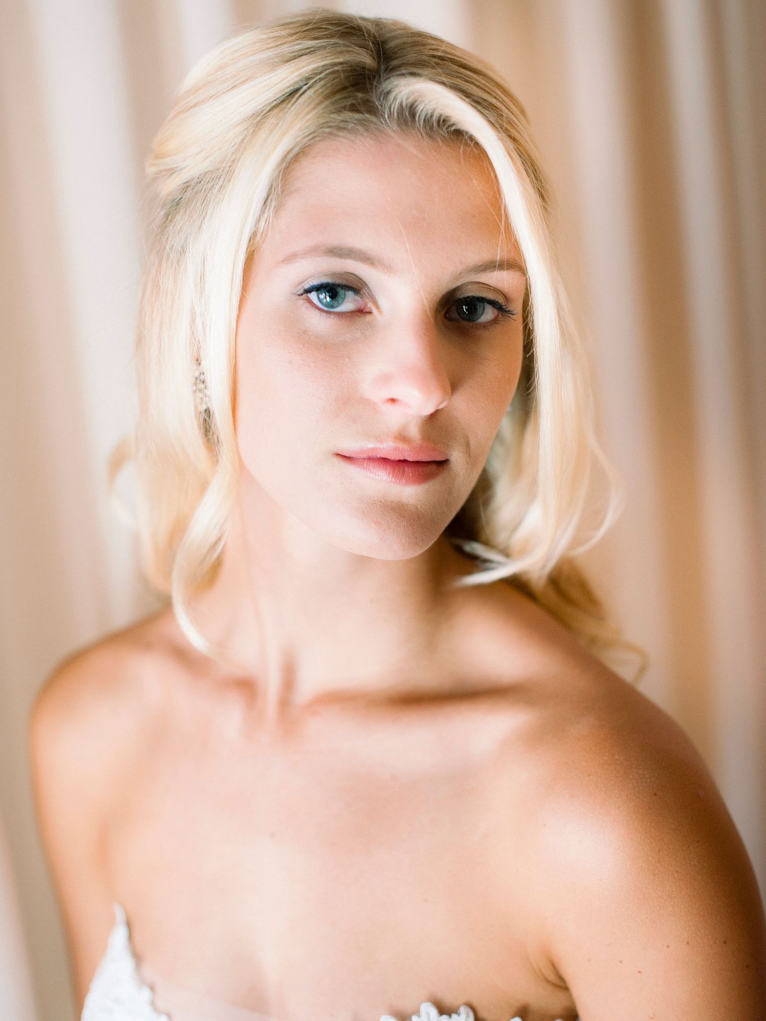 A series of artistic portrait photos showing a blonde model against a light background in various elegant poses.