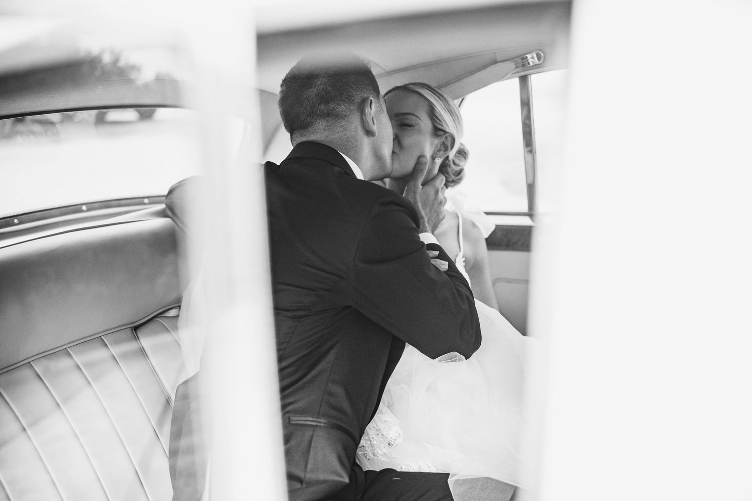 Black and white photo series showing emotional wedding moments between couples and family members embracing.