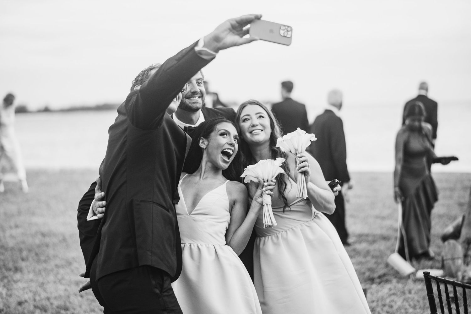 A joyful black and white wedding photo collage showing candid moments of celebration and laughter outdoors.